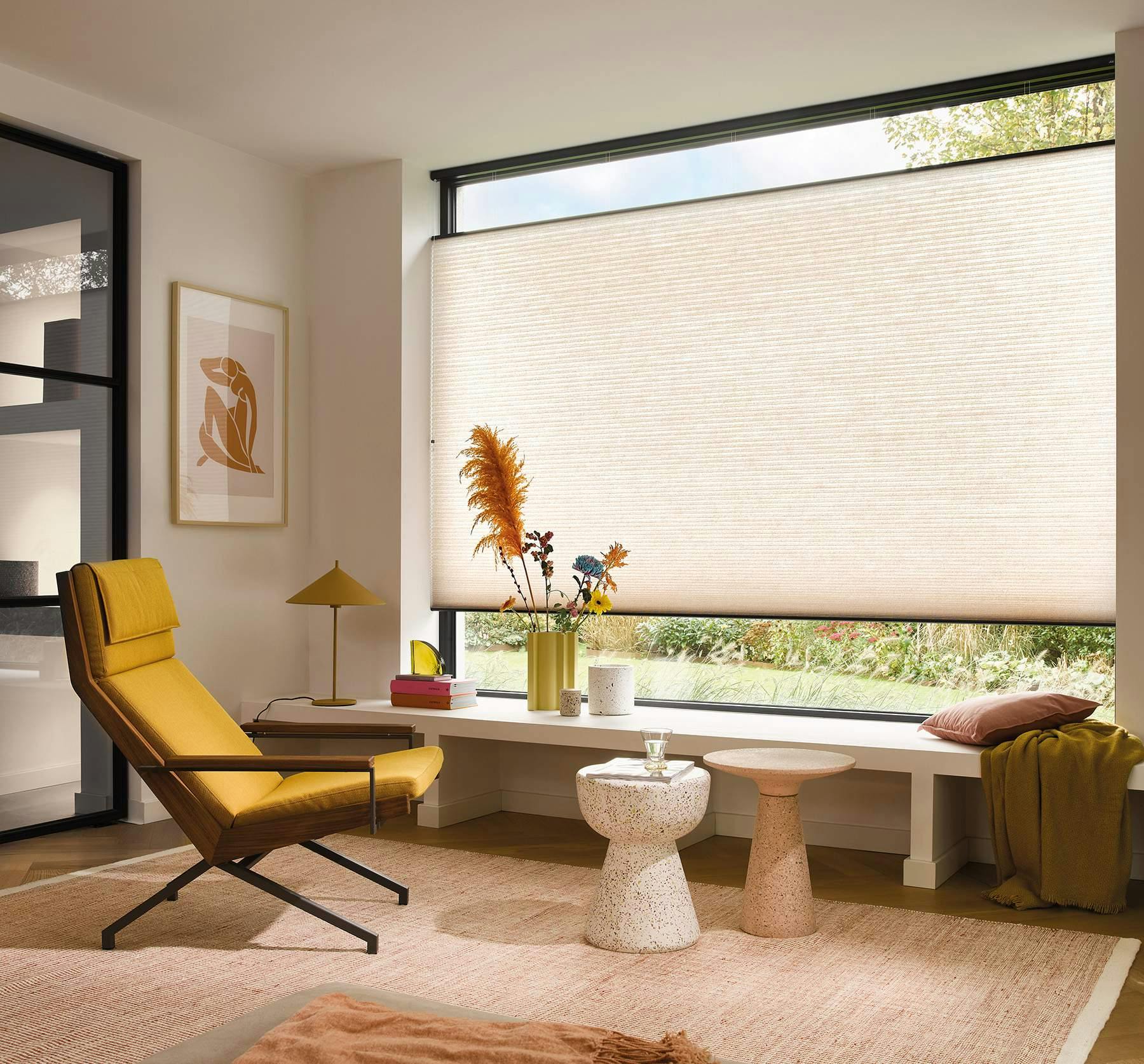 Light spacious room with cream Duette® Blinds on a large window
