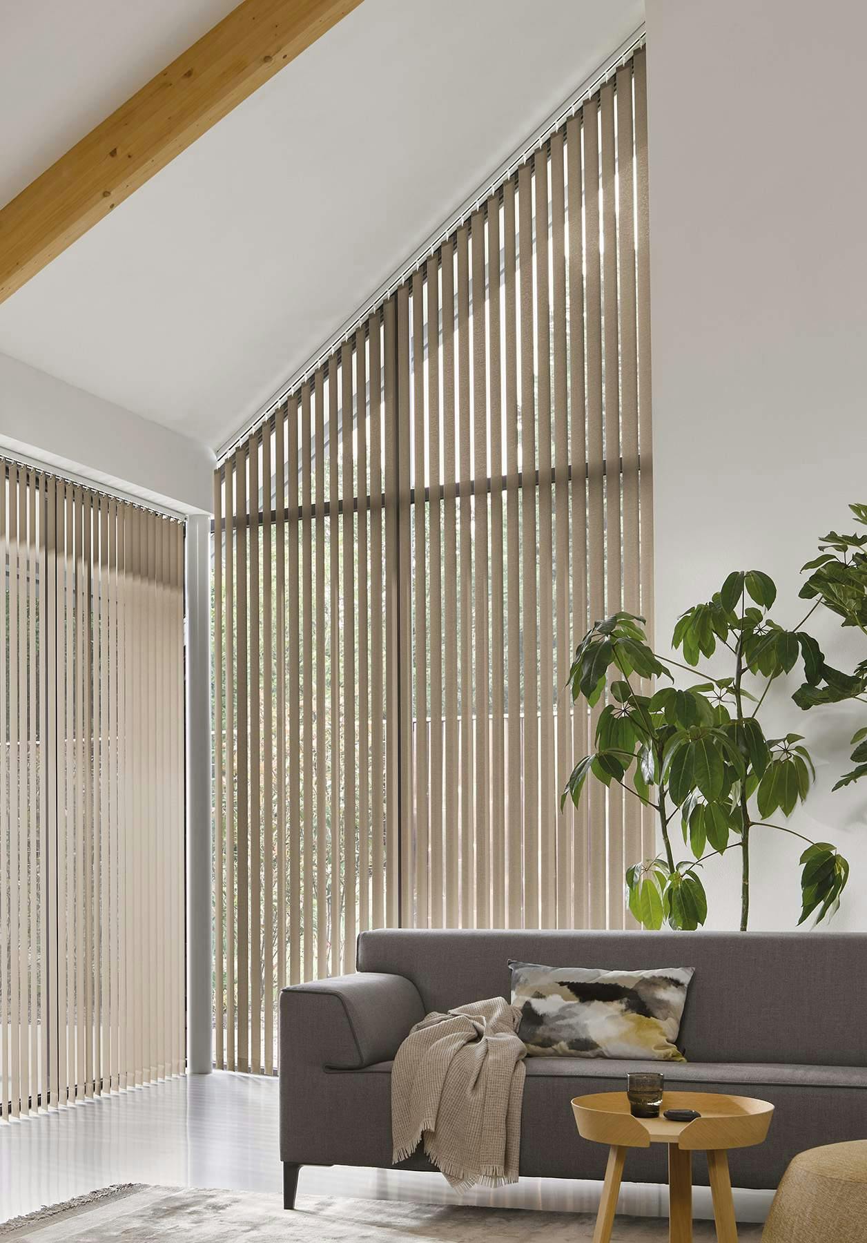 Modern living room with light brown Vertical blinds on windows