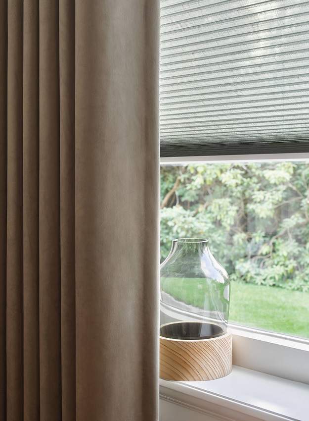Side view of white Duette blinds on a standard window 
