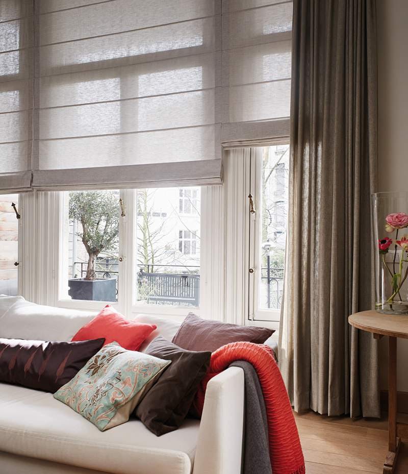living room with white Roman blinds