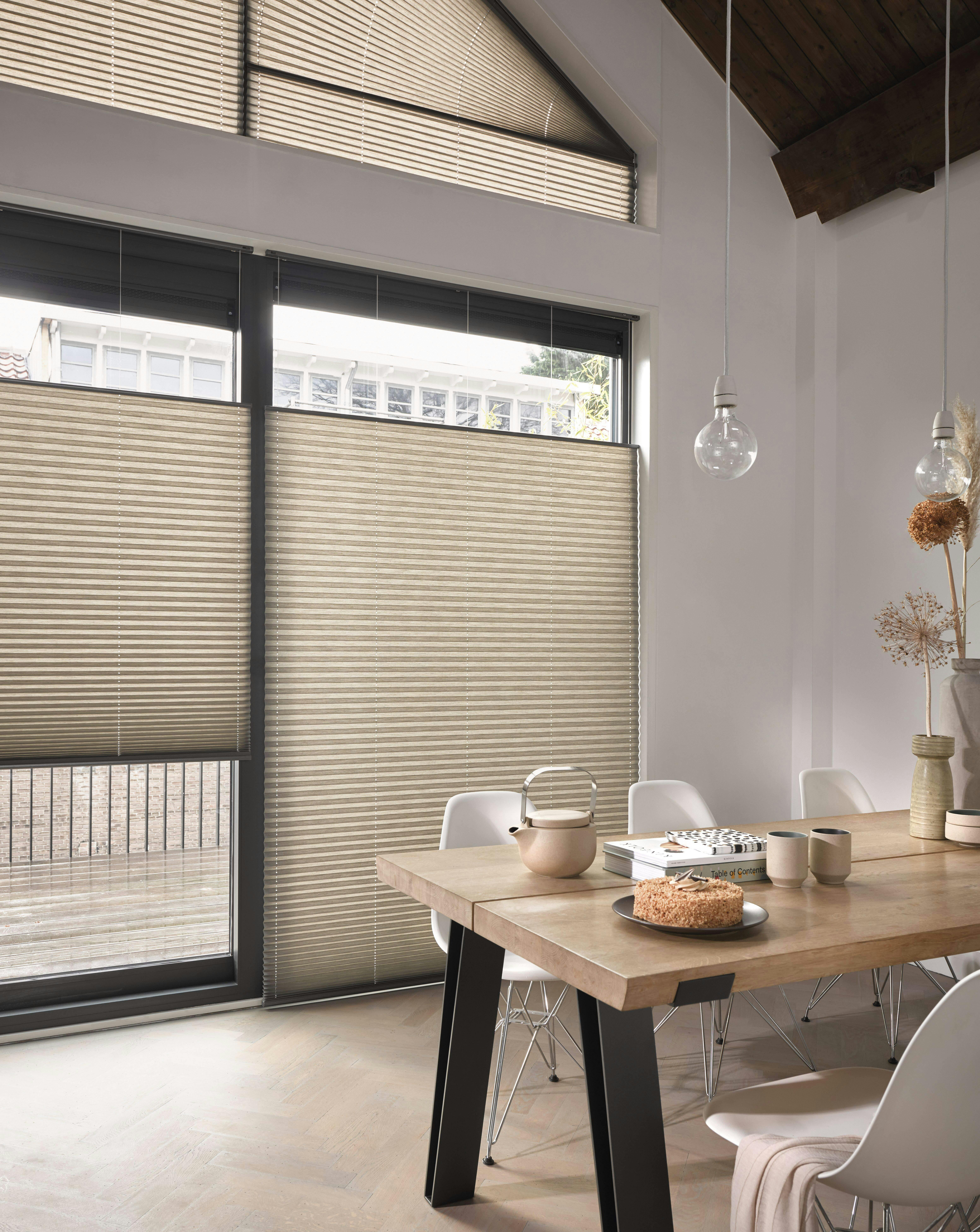Dining room with grey Plissé shades