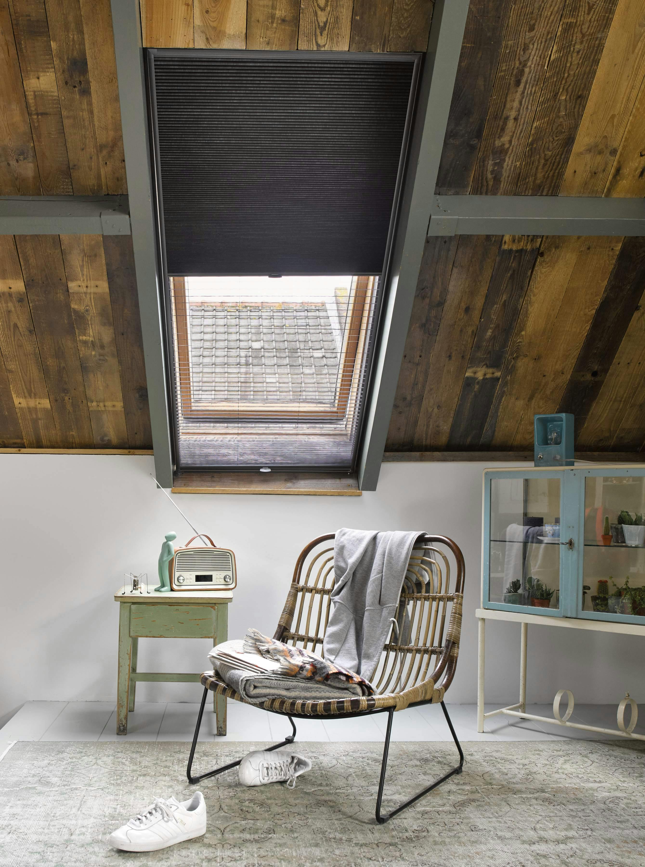 loft bedroom with black duette shades 
