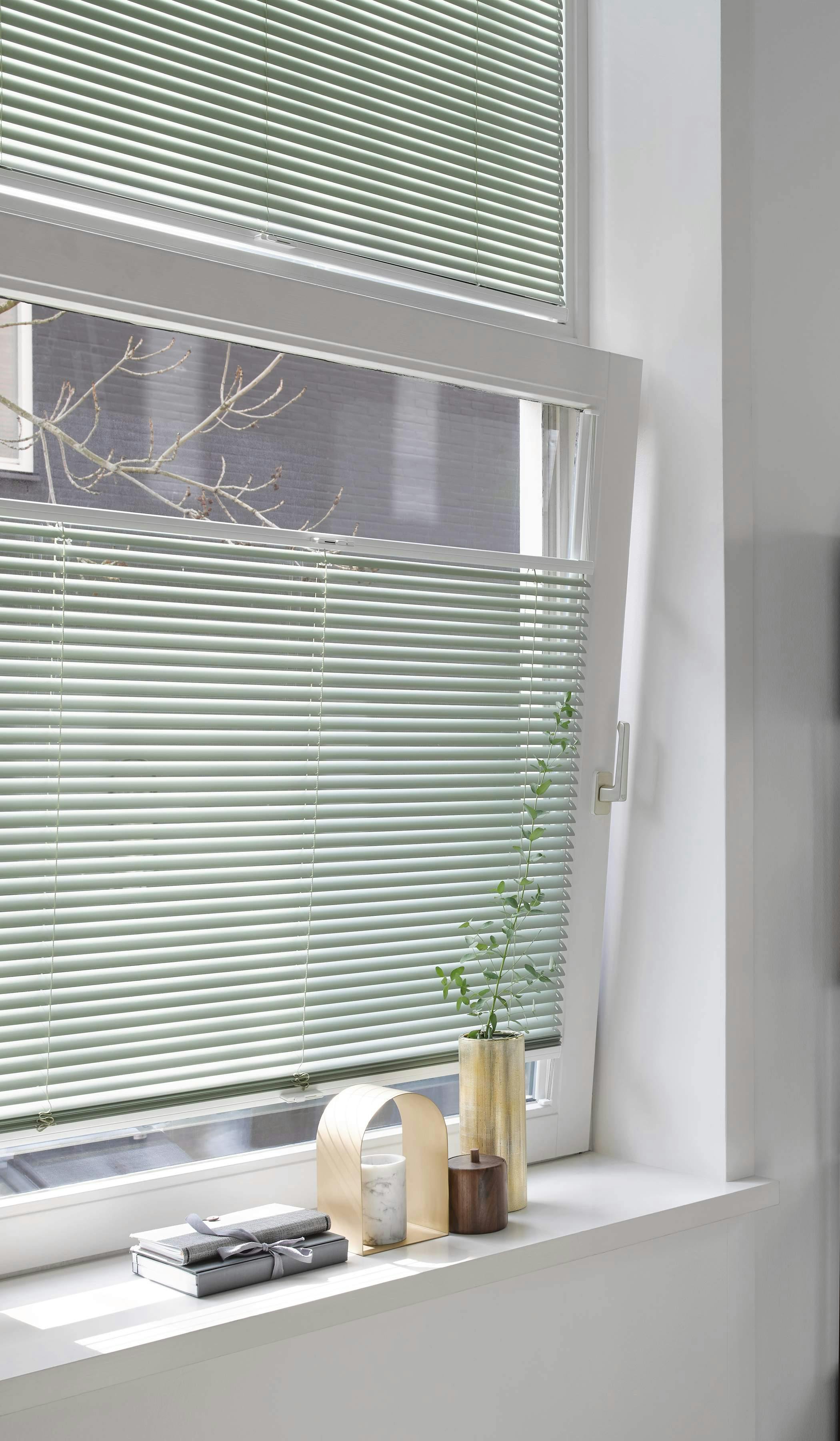 Tilt and turn green Venetian blinds