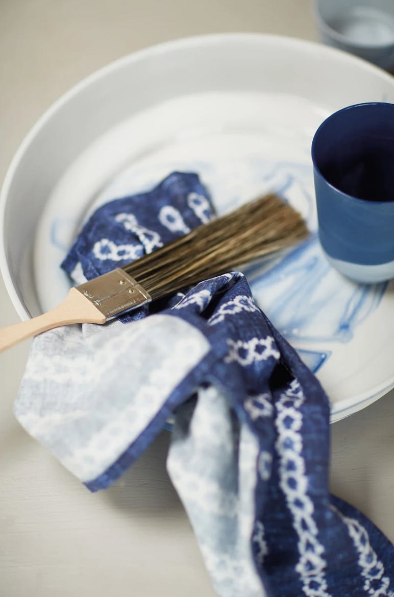 blue fabric and painting brush on palette 