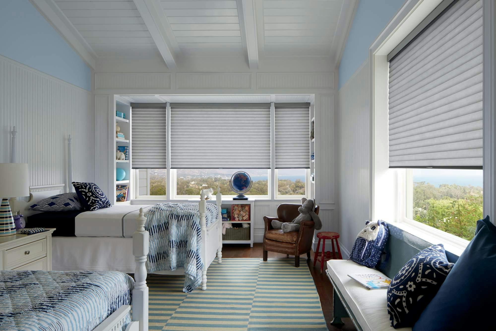 Light blue kids room with white Sonnette® shades
