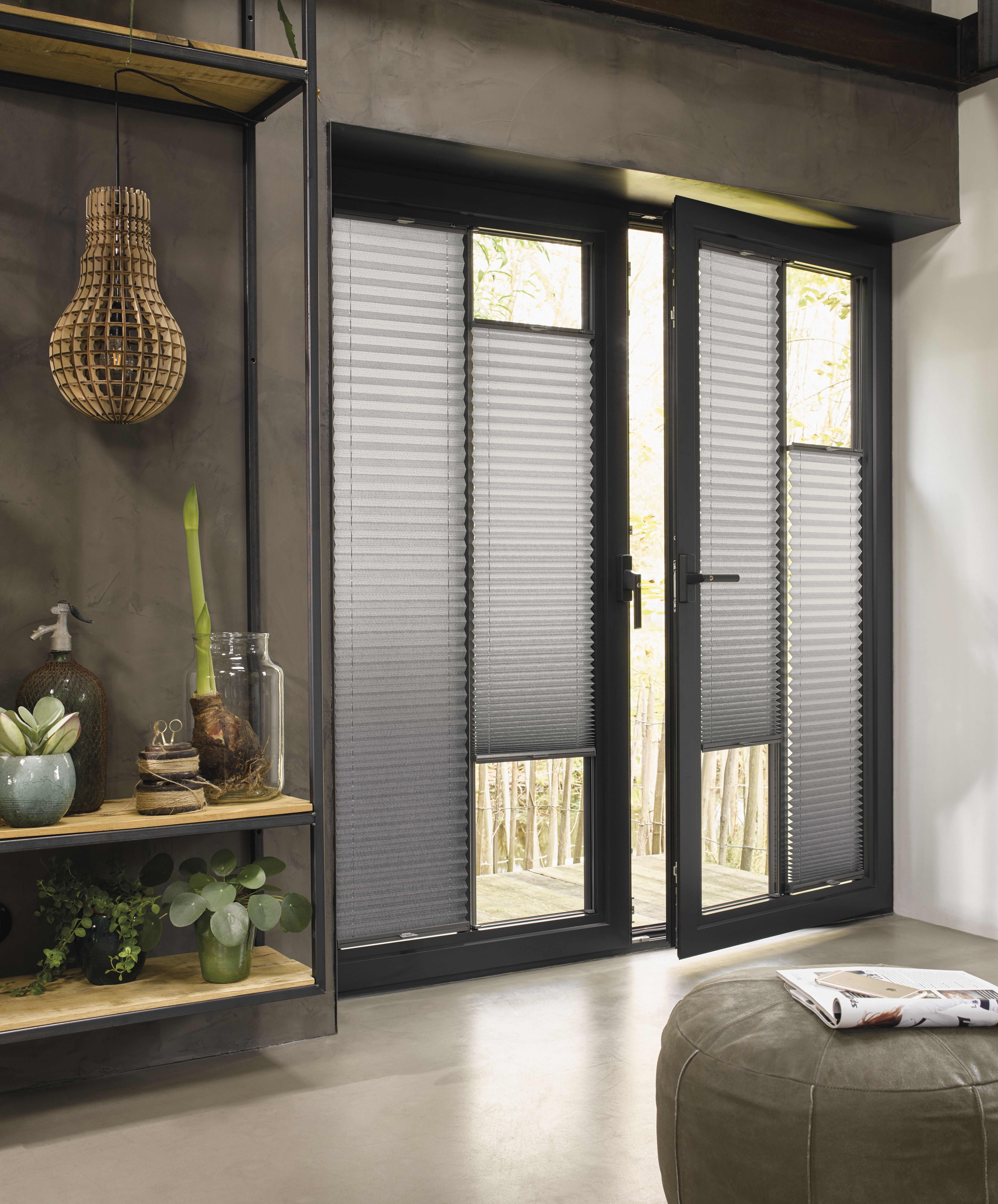 Modern living room with grey Plissé shades on screen doors