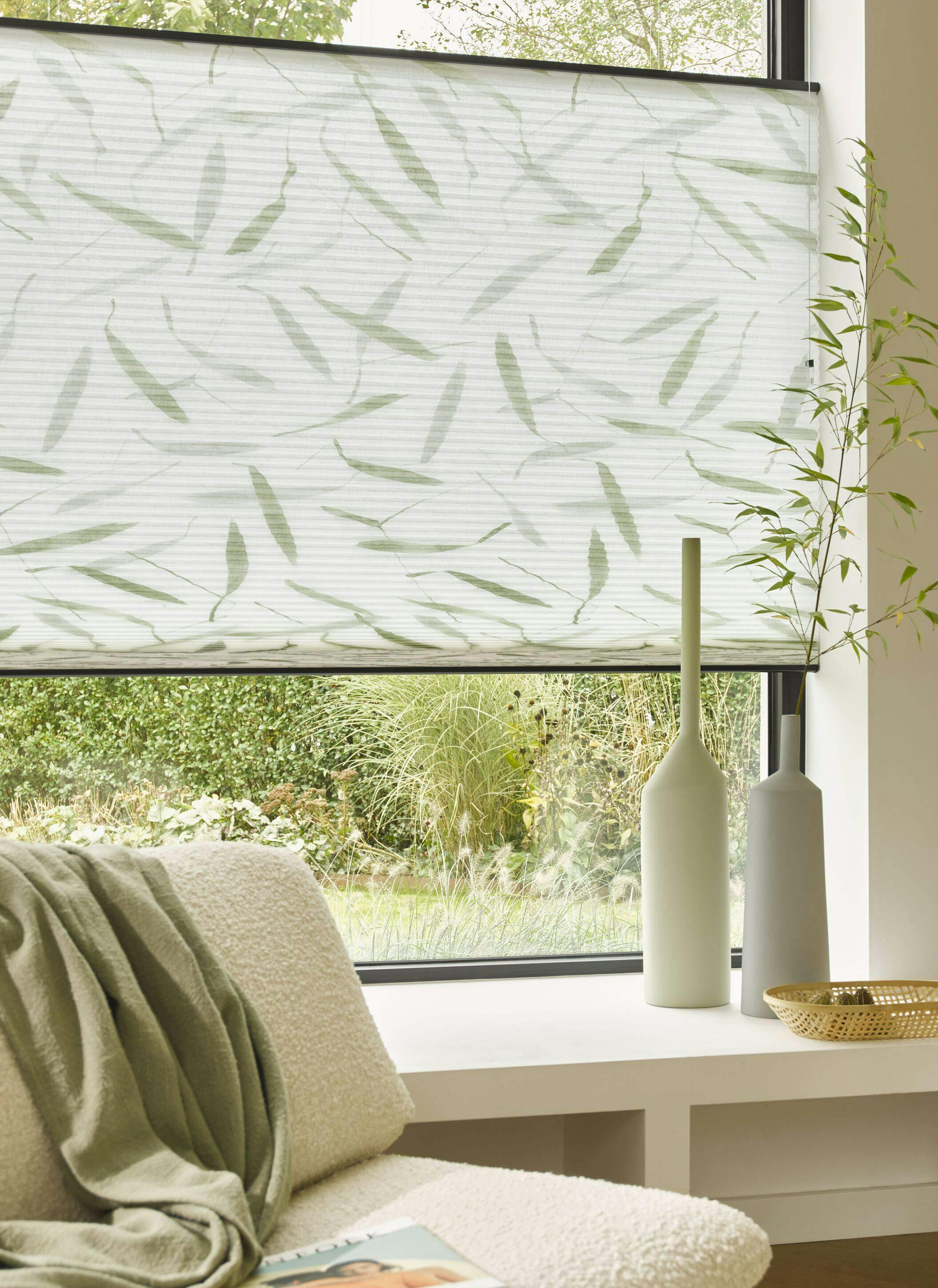 White patterned Duette® shades on a standard window

