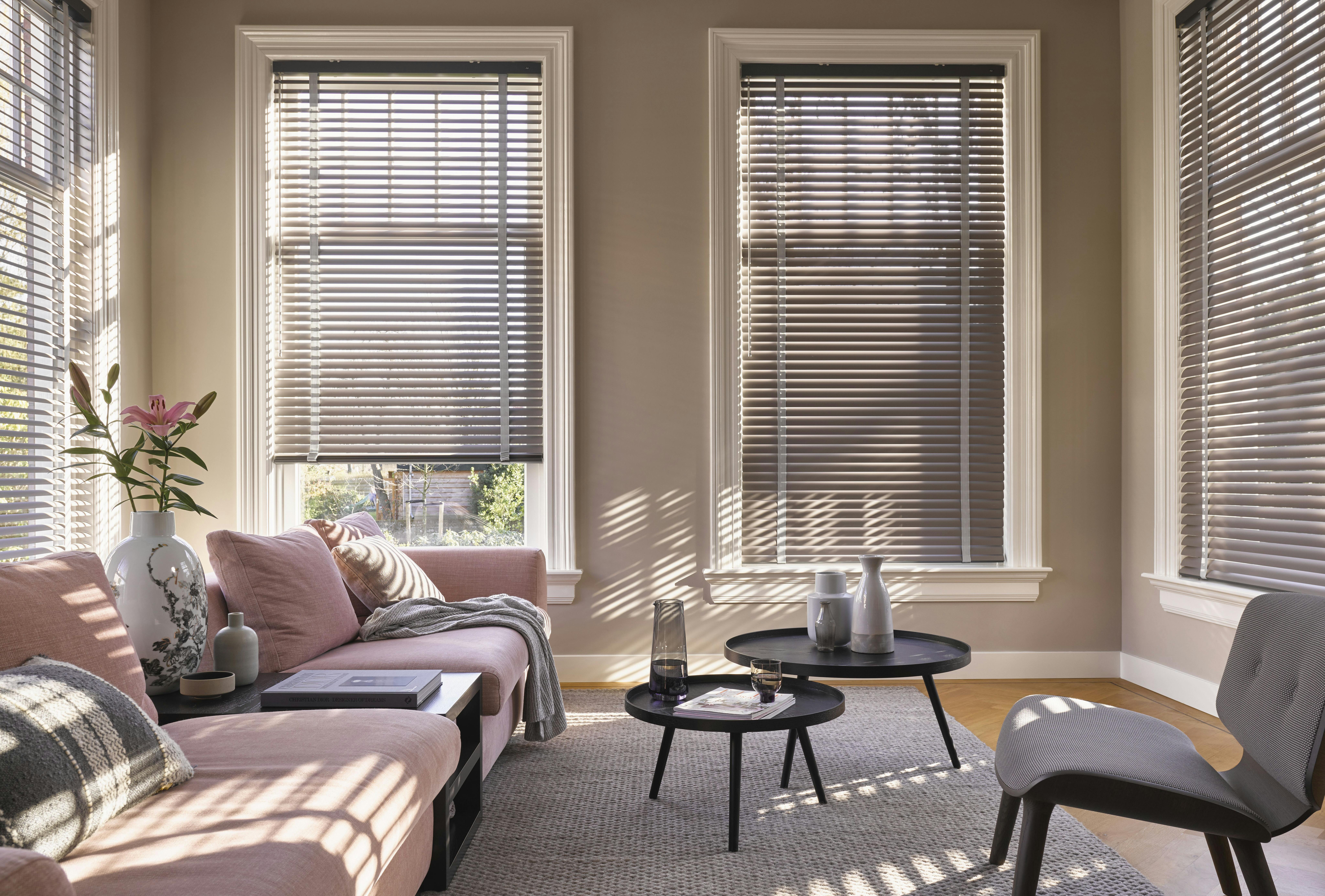 Living room with brown Venetian blinds on standard windows