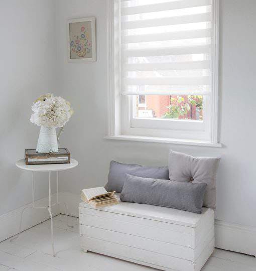 White duo roller blinds on a standard window