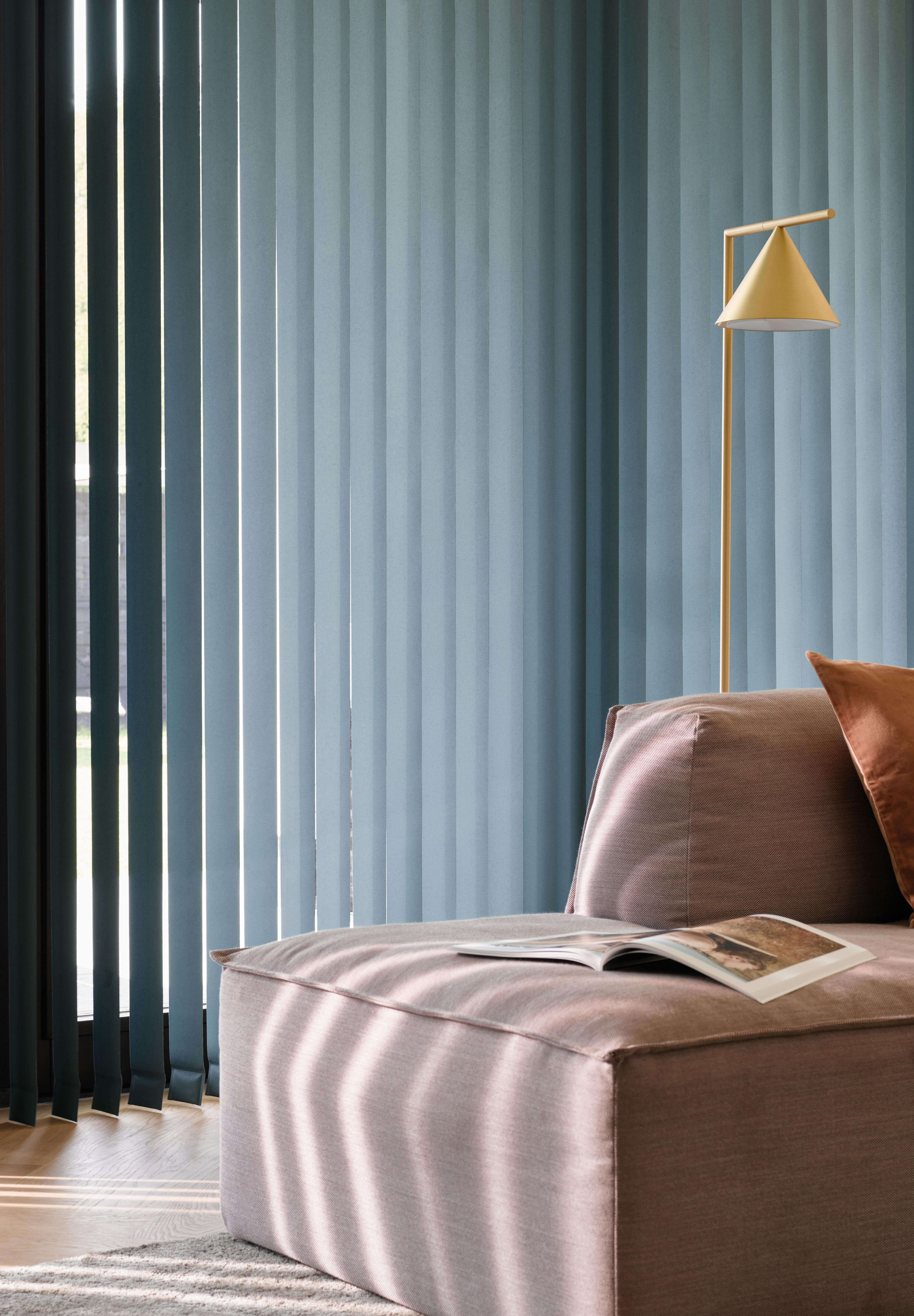 living room with blue vertical blinds