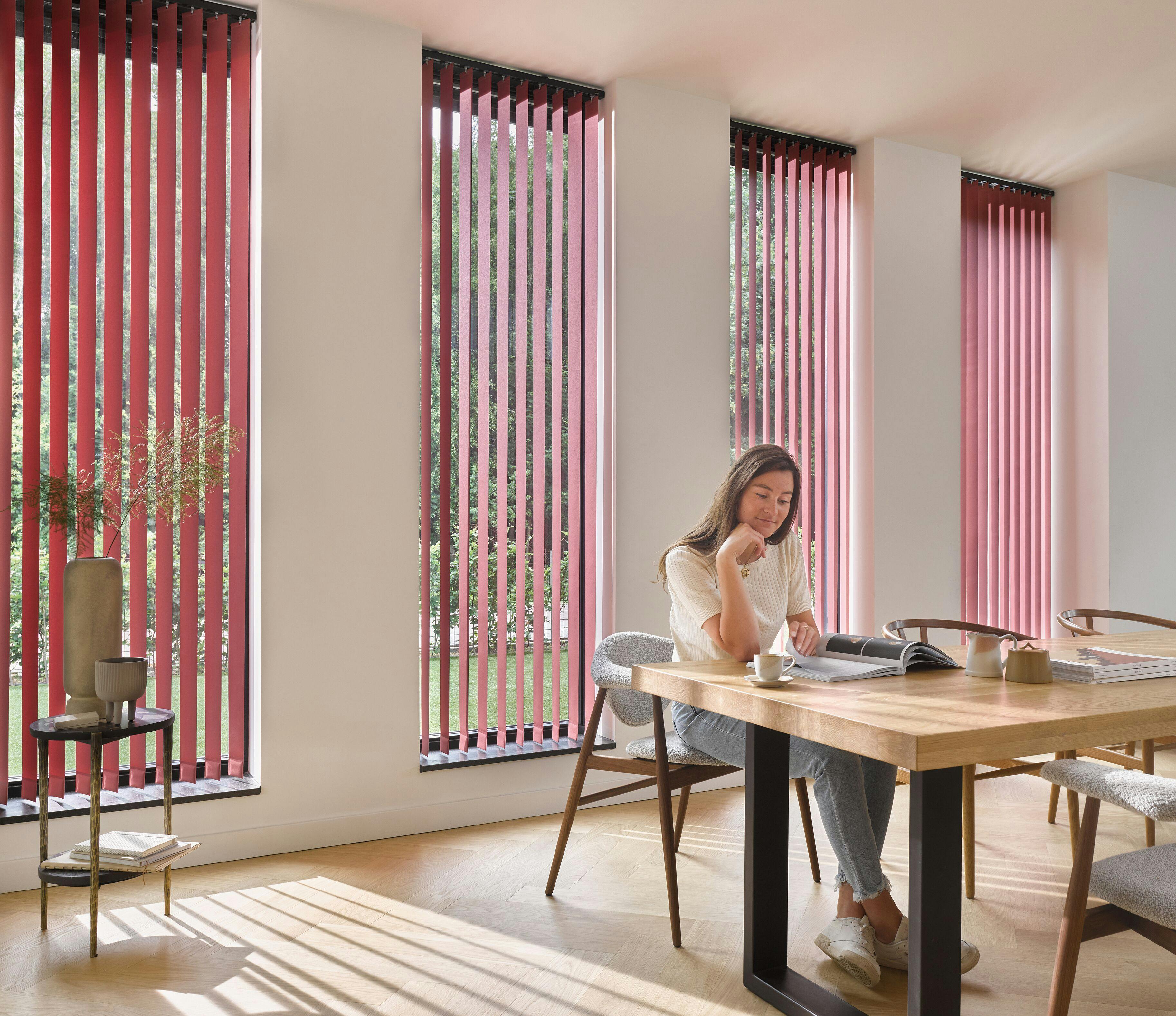dining room with red vertical blinds