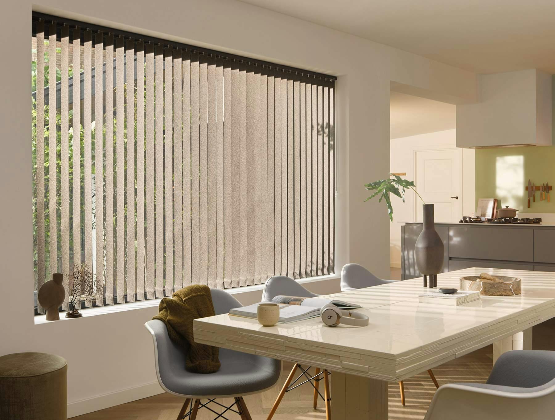dining room with brown vertical blinds