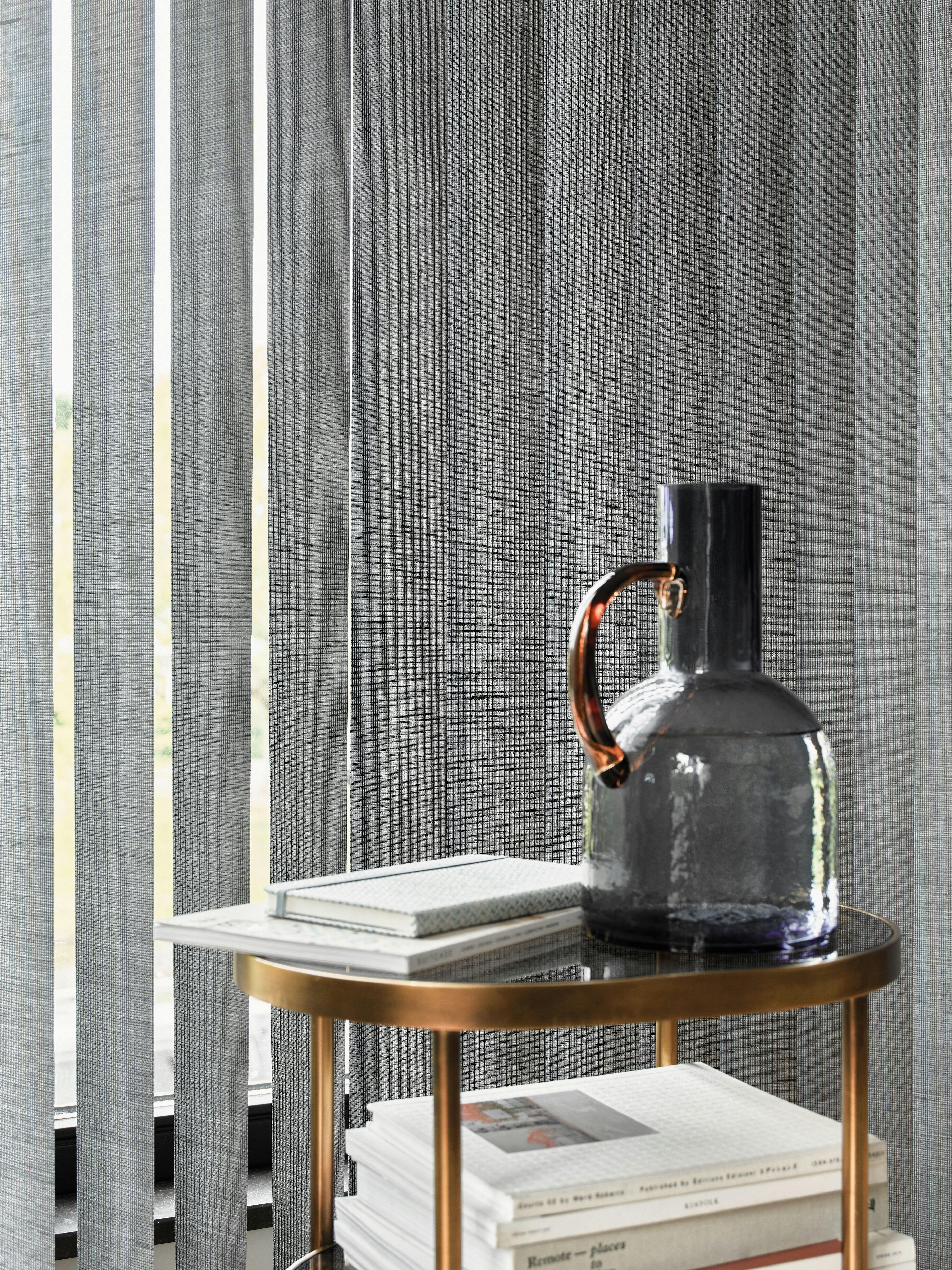 living room with grey vertical blinds