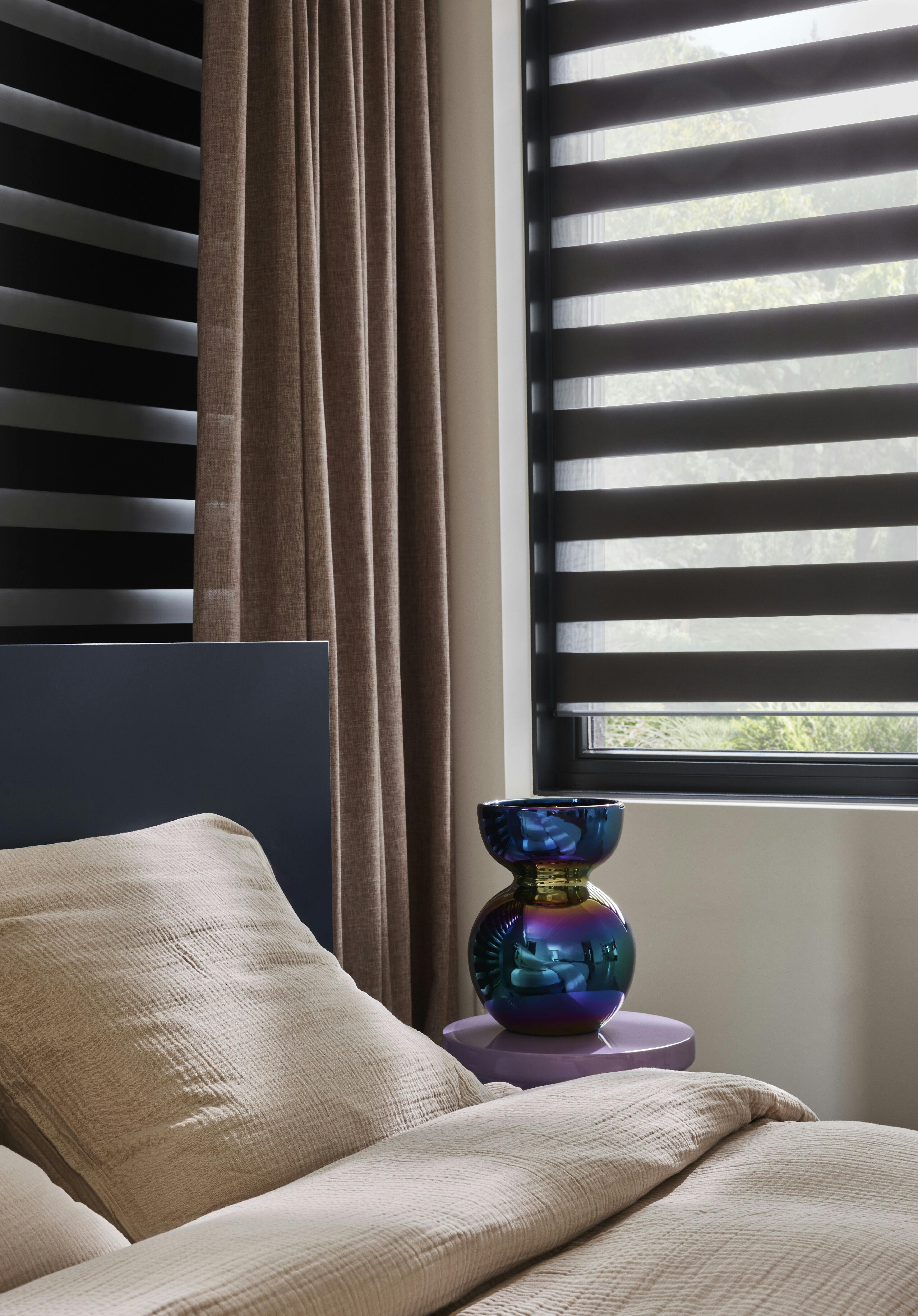 bedroom with black duo roller blinds