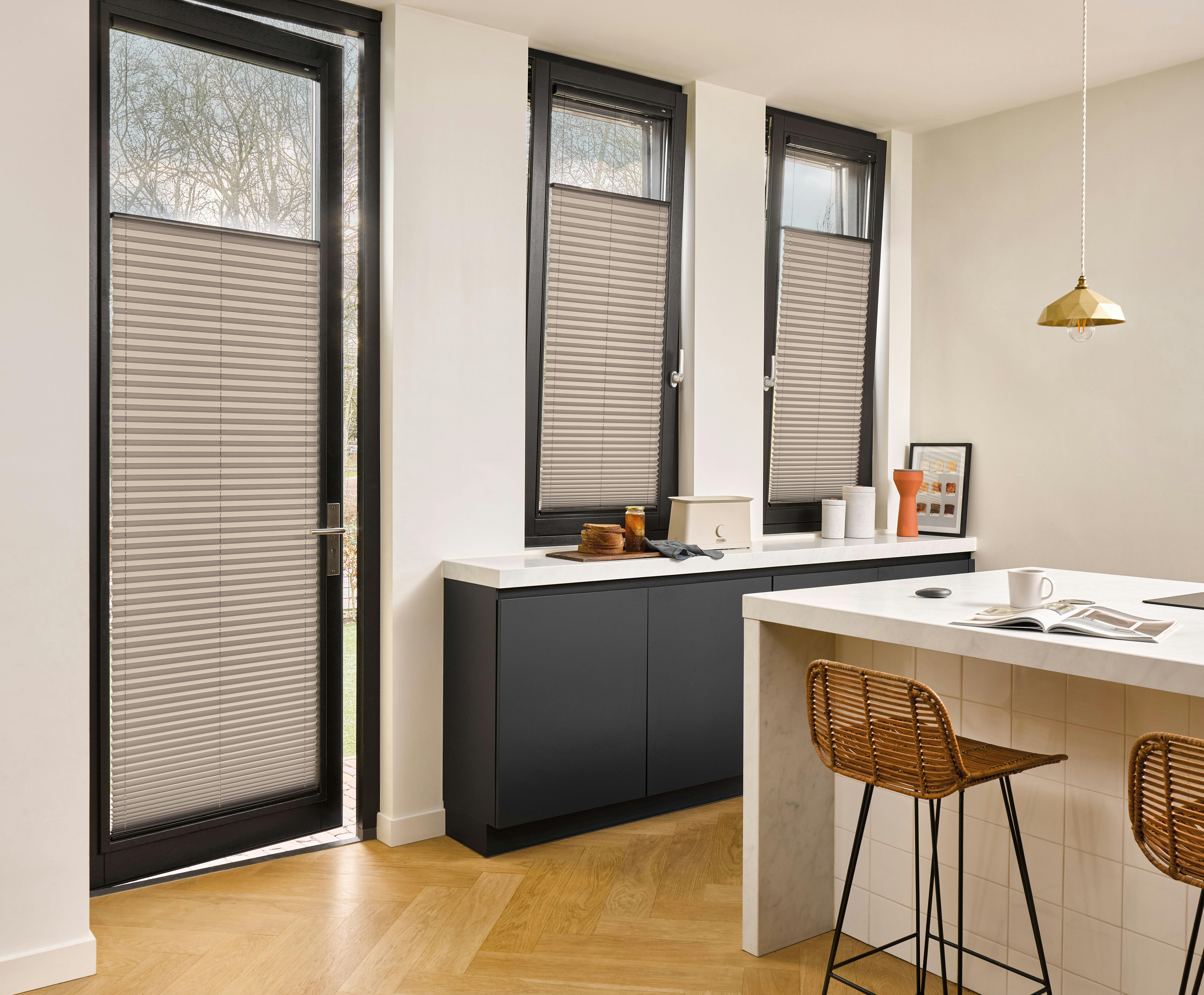 dining room with grey plisse shades