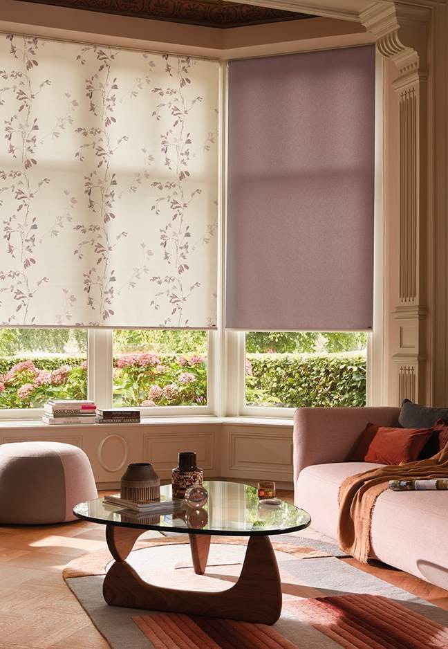 living room with purple and multi conservatory roller blinds
