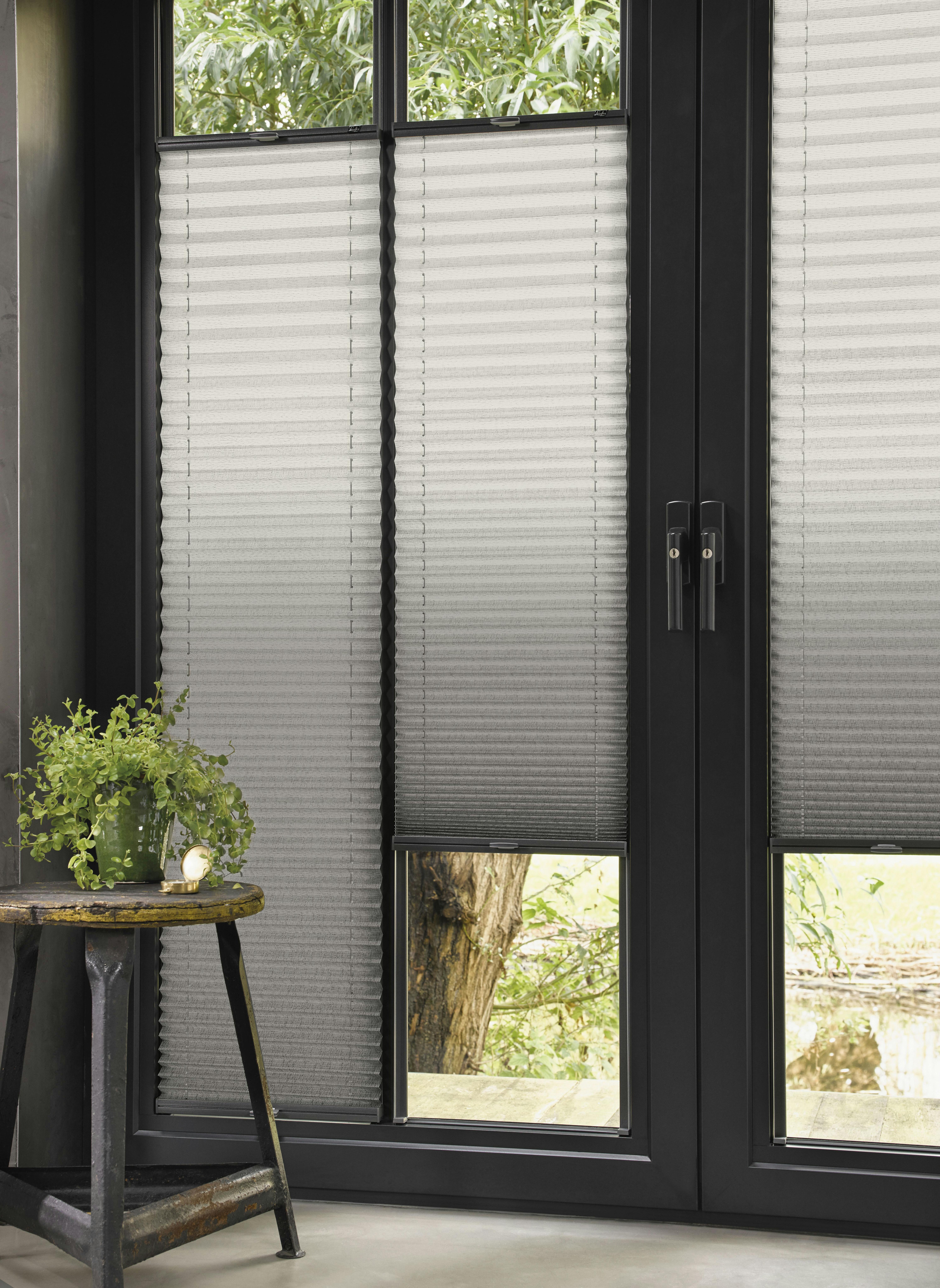 living room with grey plisse blinds