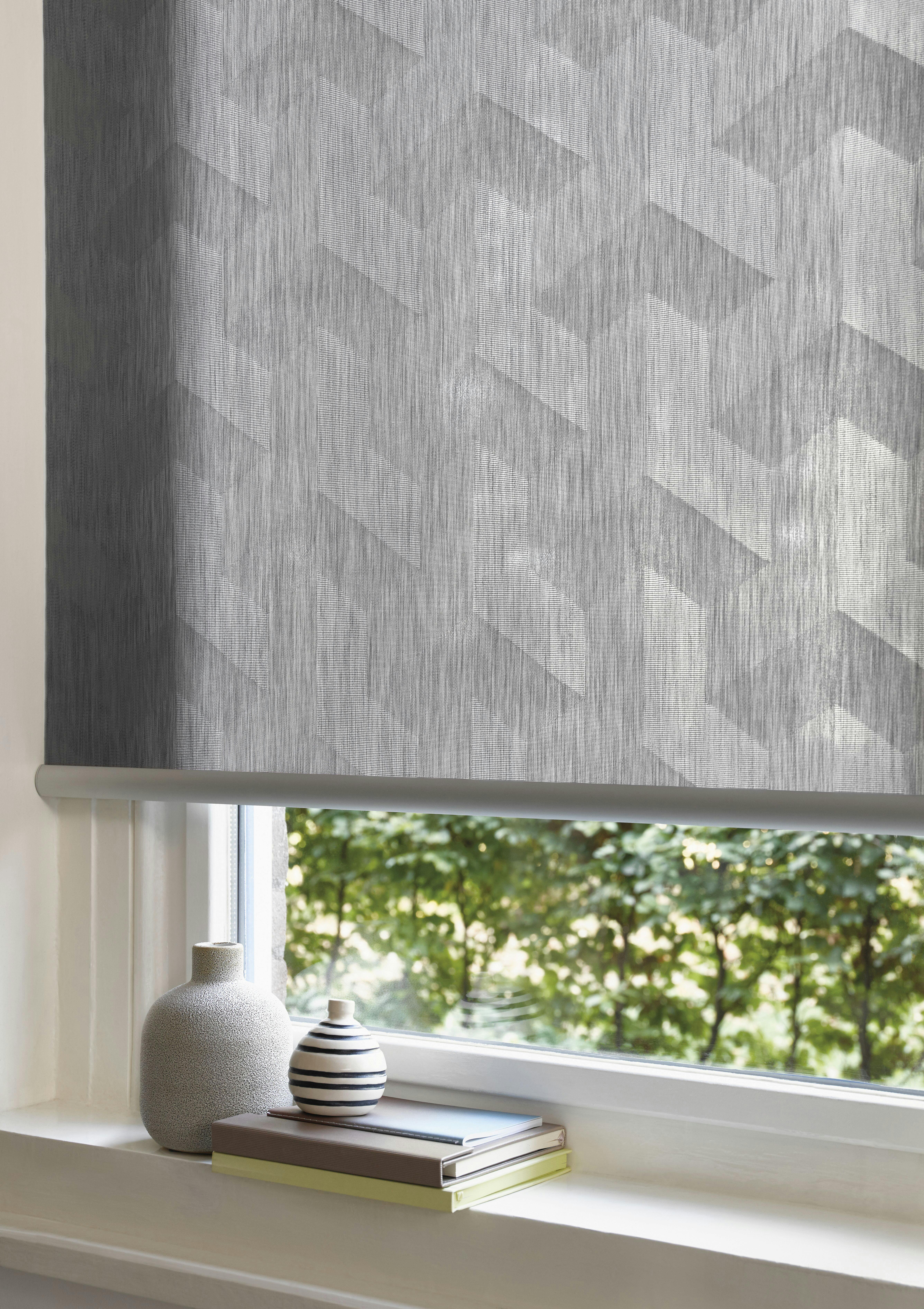 living room with grey design roller blinds