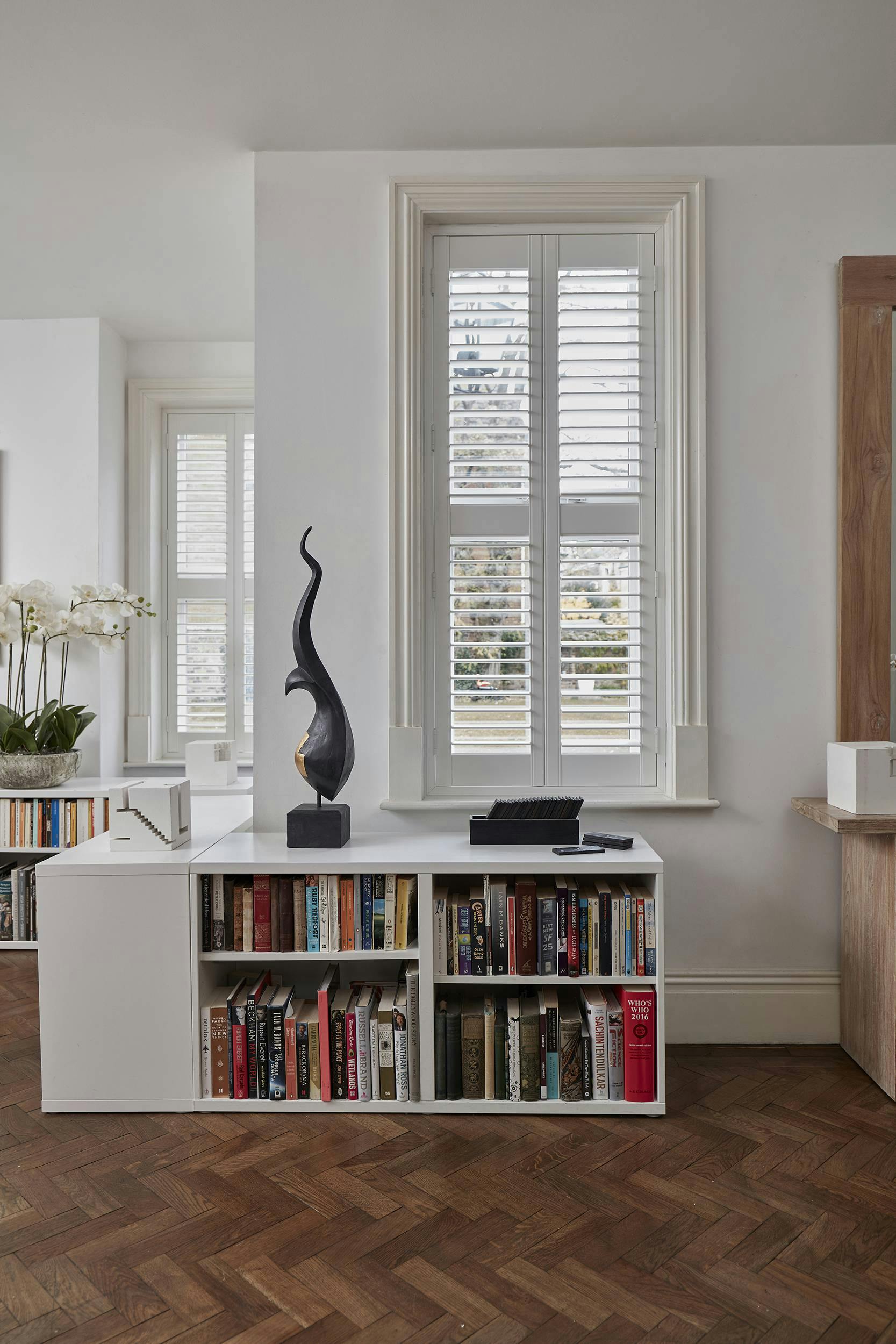  living room with white wooden shutters