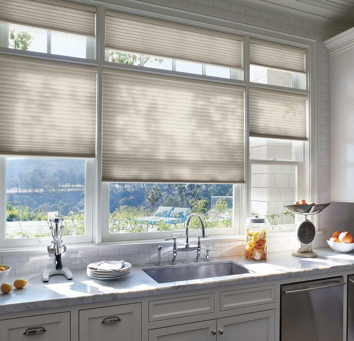 Modern kitchen with cream Plissé shades
on windows