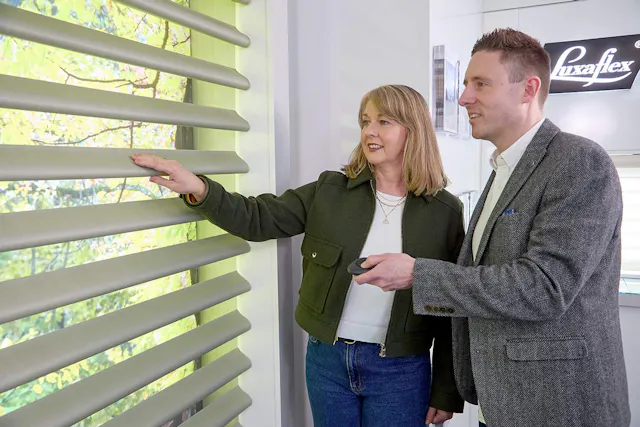 Luxaflex® dealer and a client in a showroom
