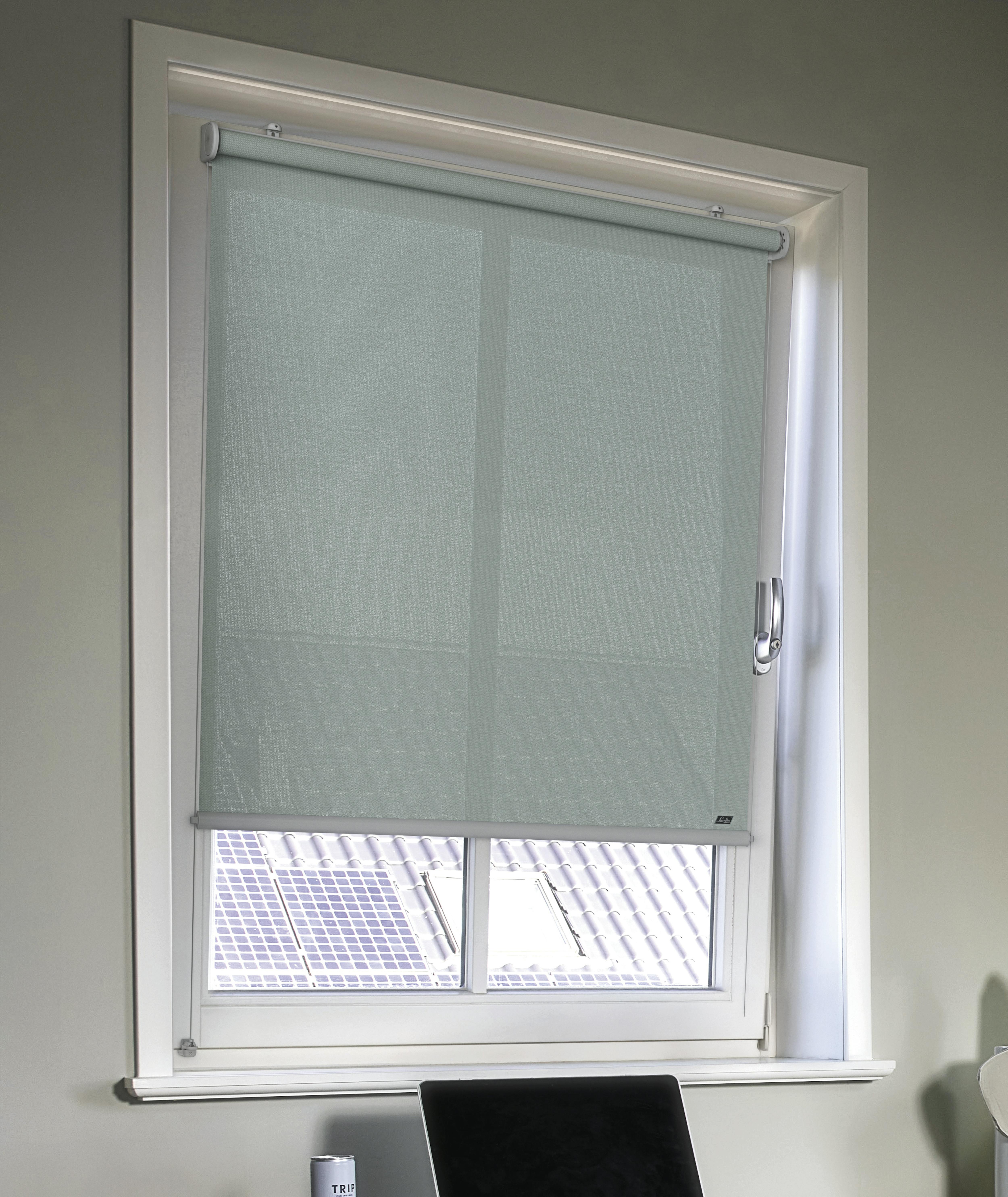 Cosy home office with light teal roller blinds on windows