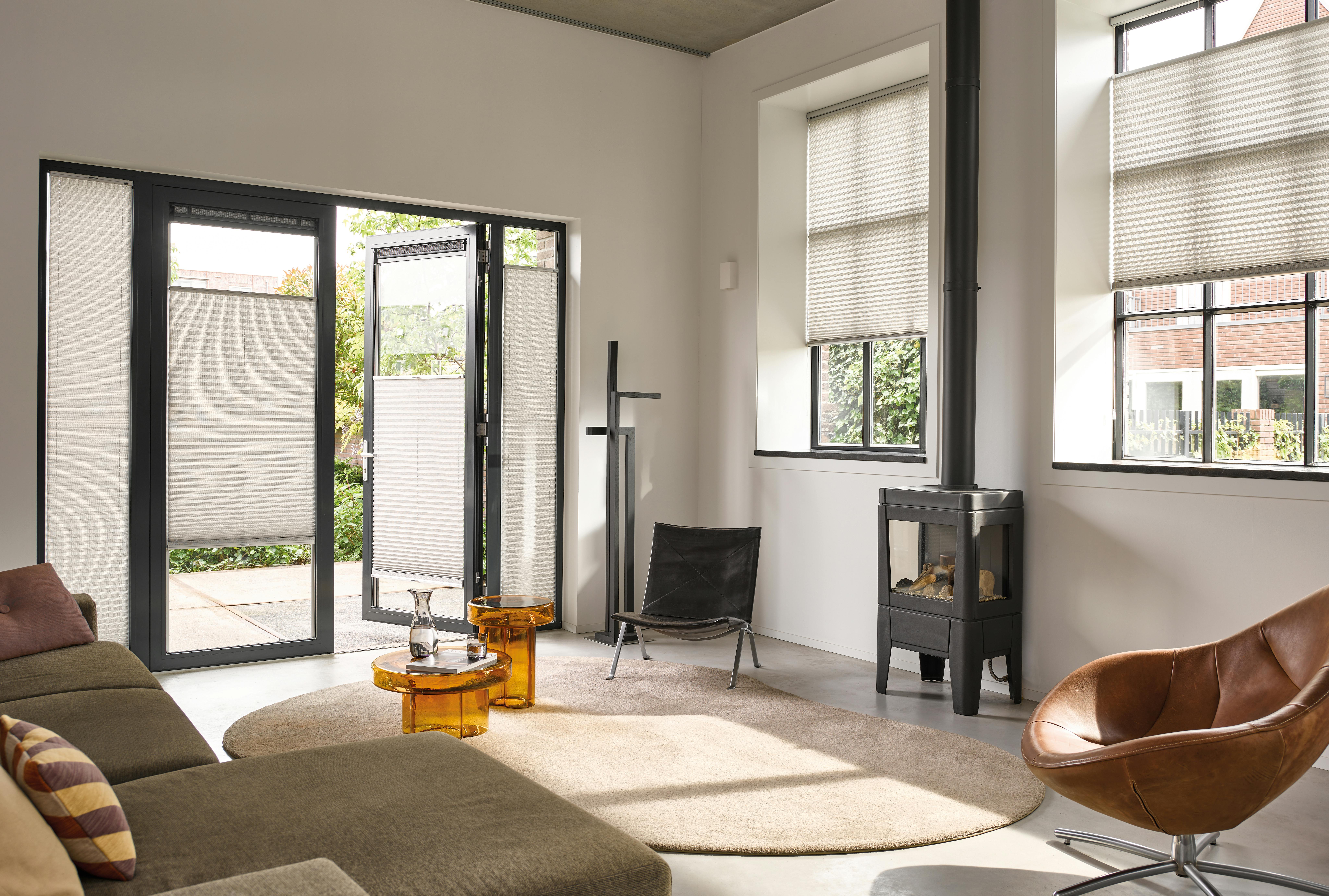 Light grey plisse shades in a modern living room 