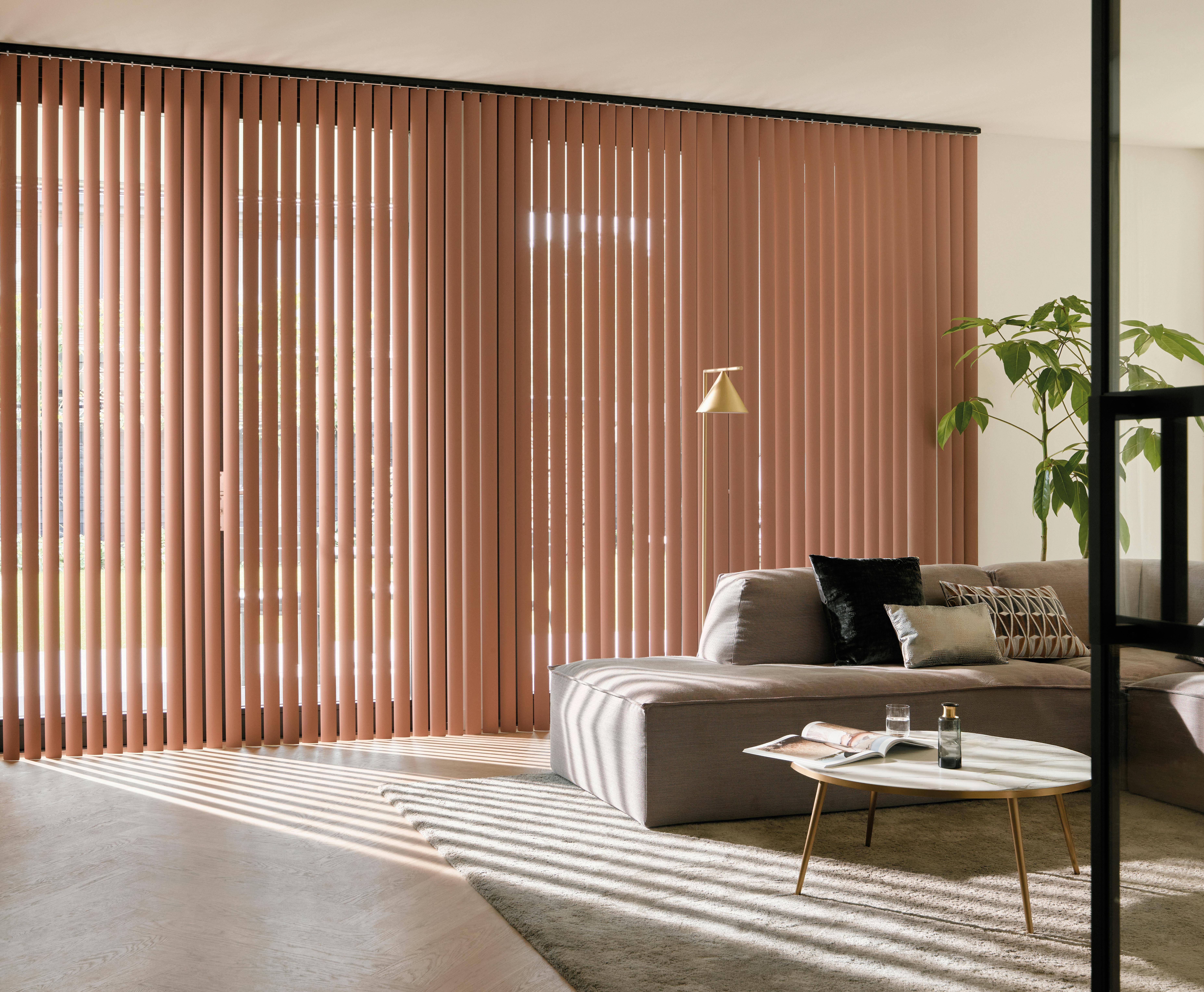 Orange vertical blinds in a living room