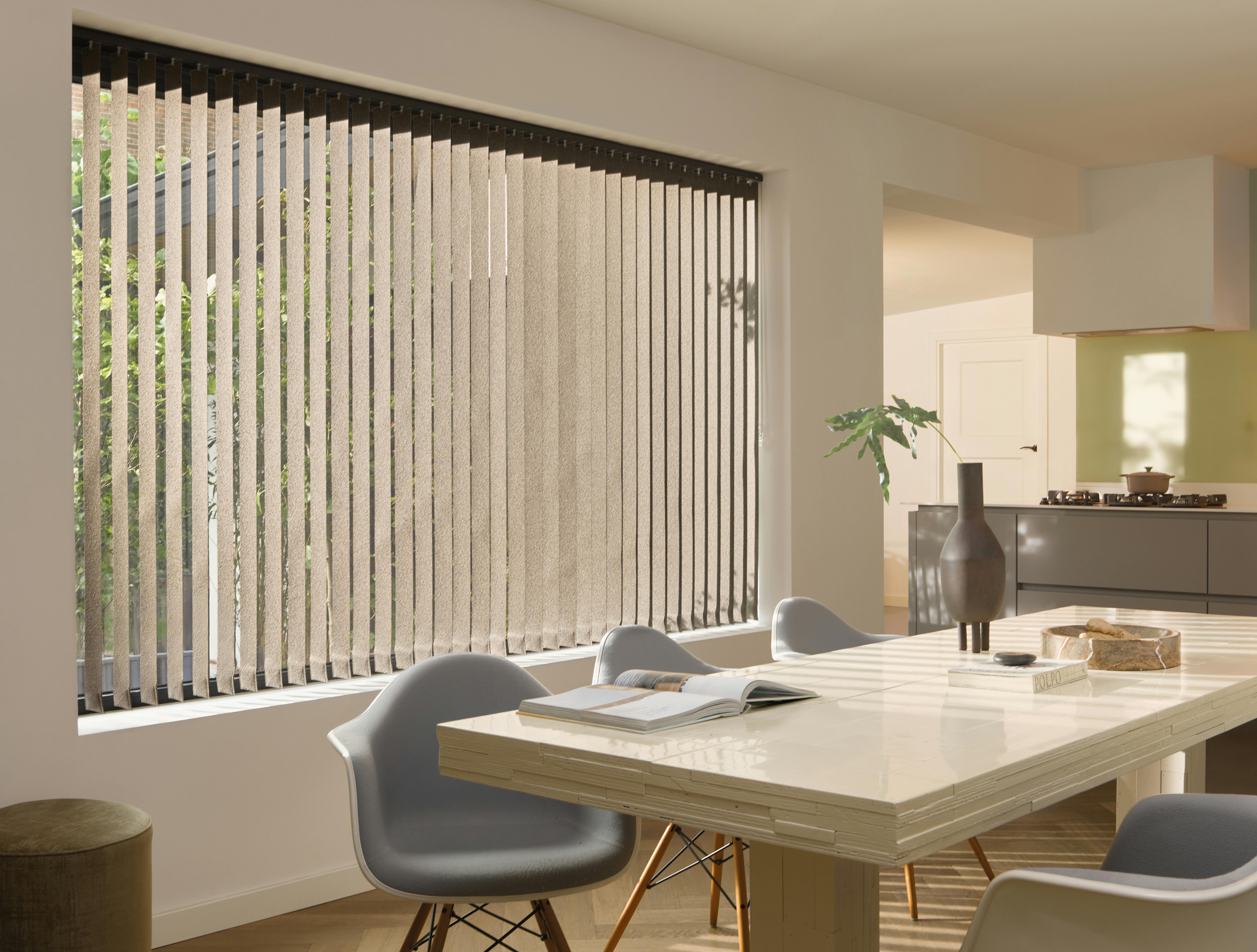 Brown vertical blinds in a dining room 