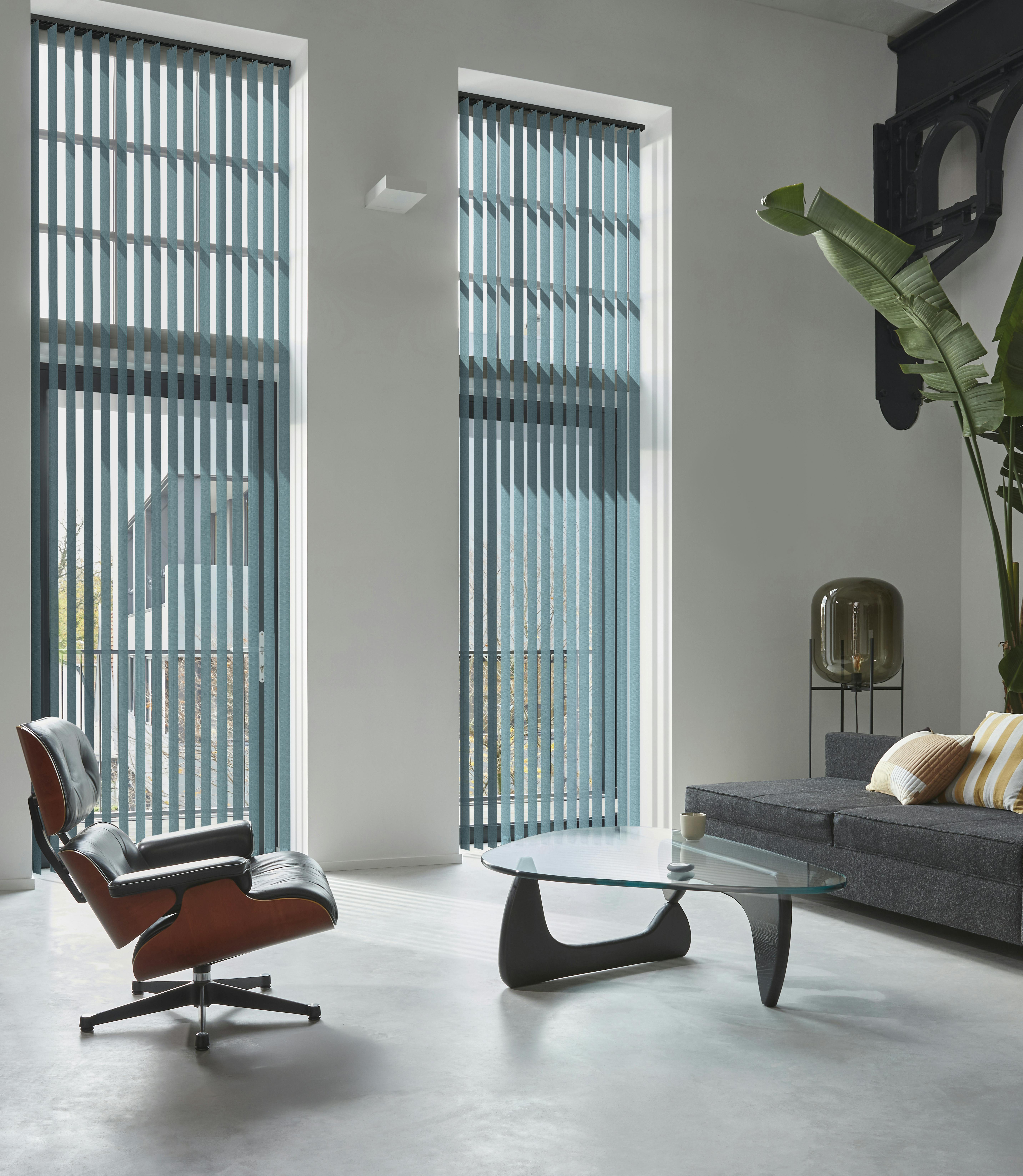 Dark blue vertical blinds in a spacious living room 