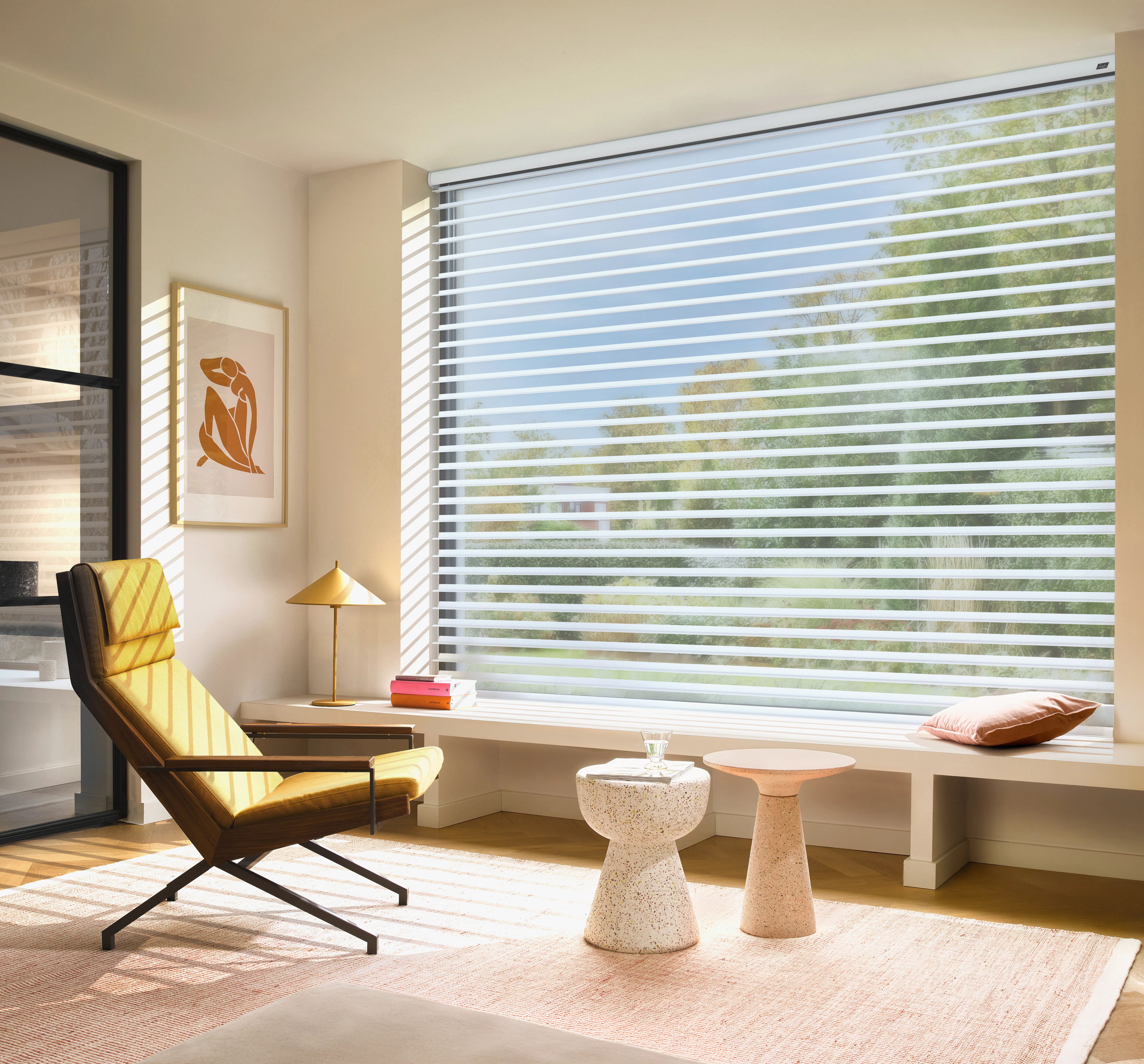 White silhouette shades on a large window in a bright and modern living room