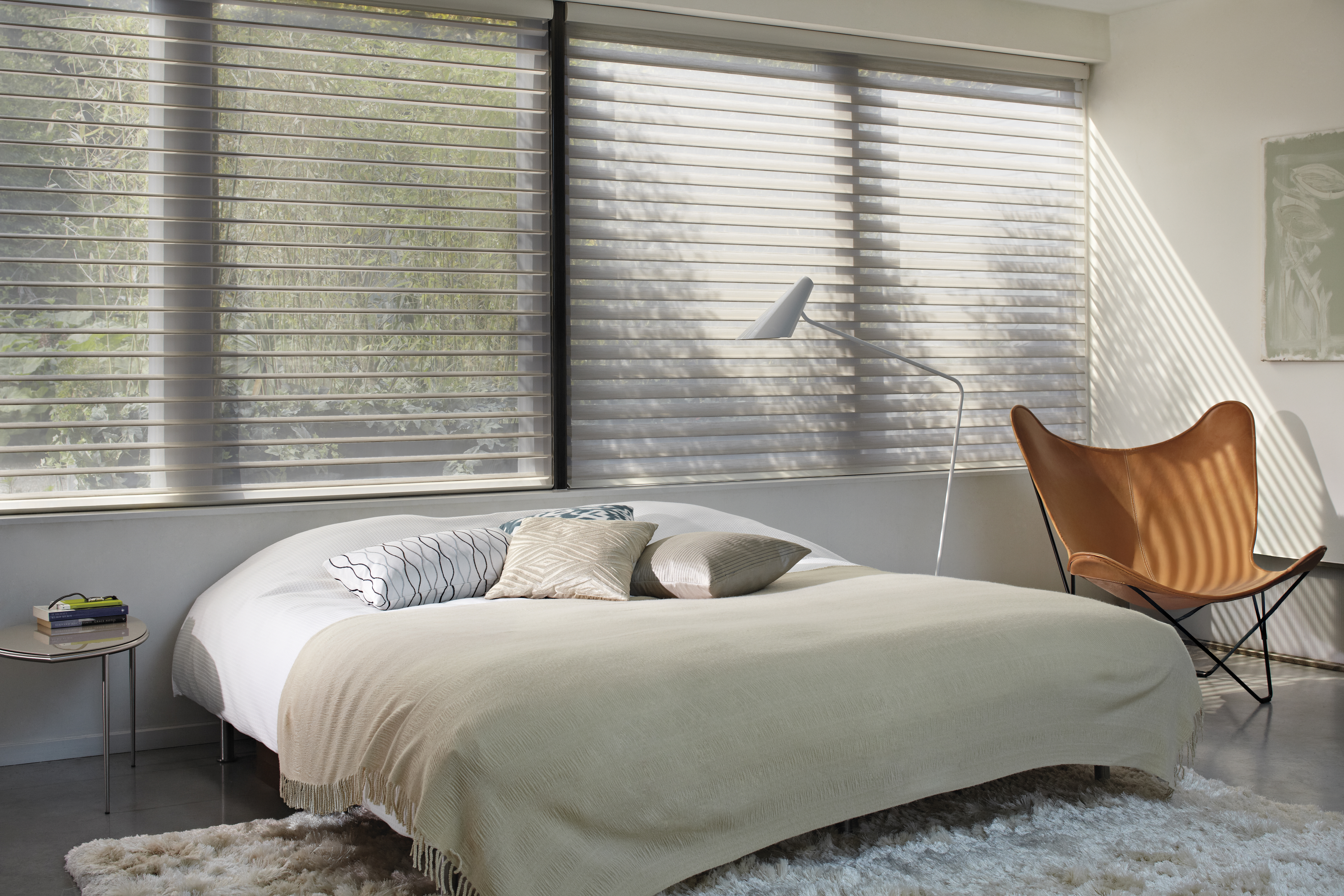 Cream silhouette shades in a bedroom 