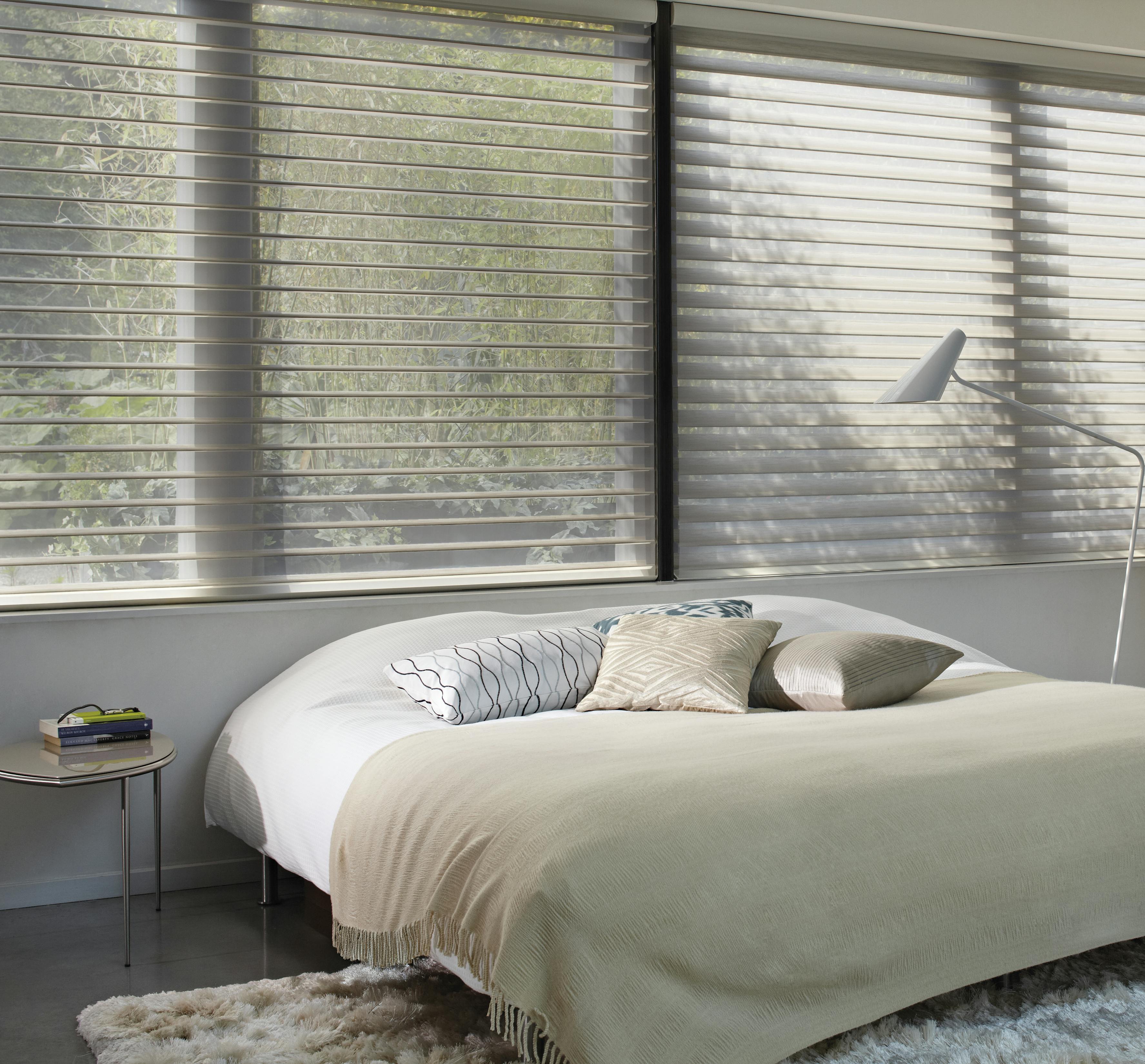 Cream silhouette shades in a bedroom