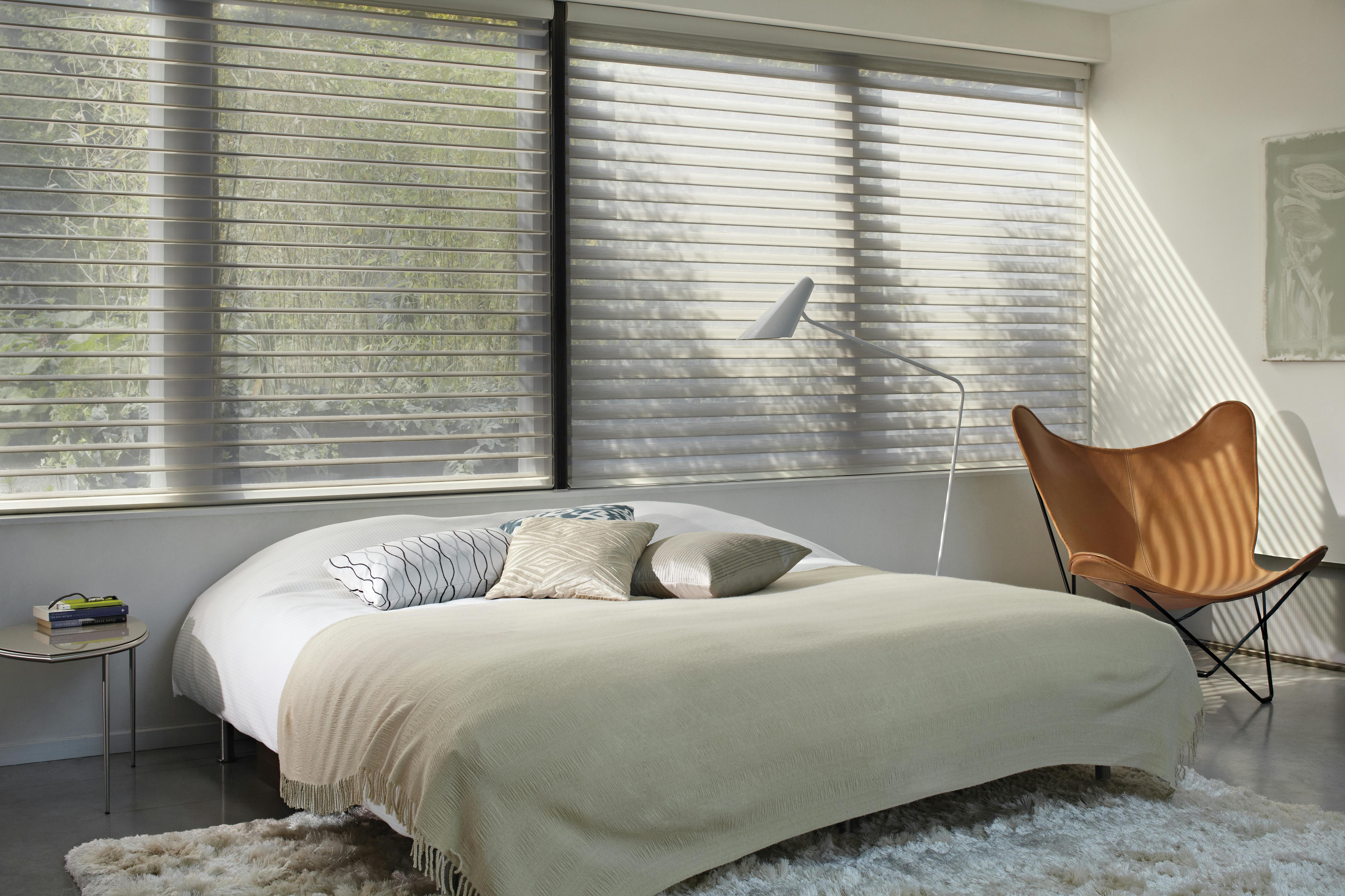 Cream silhouette shades in a bedroom