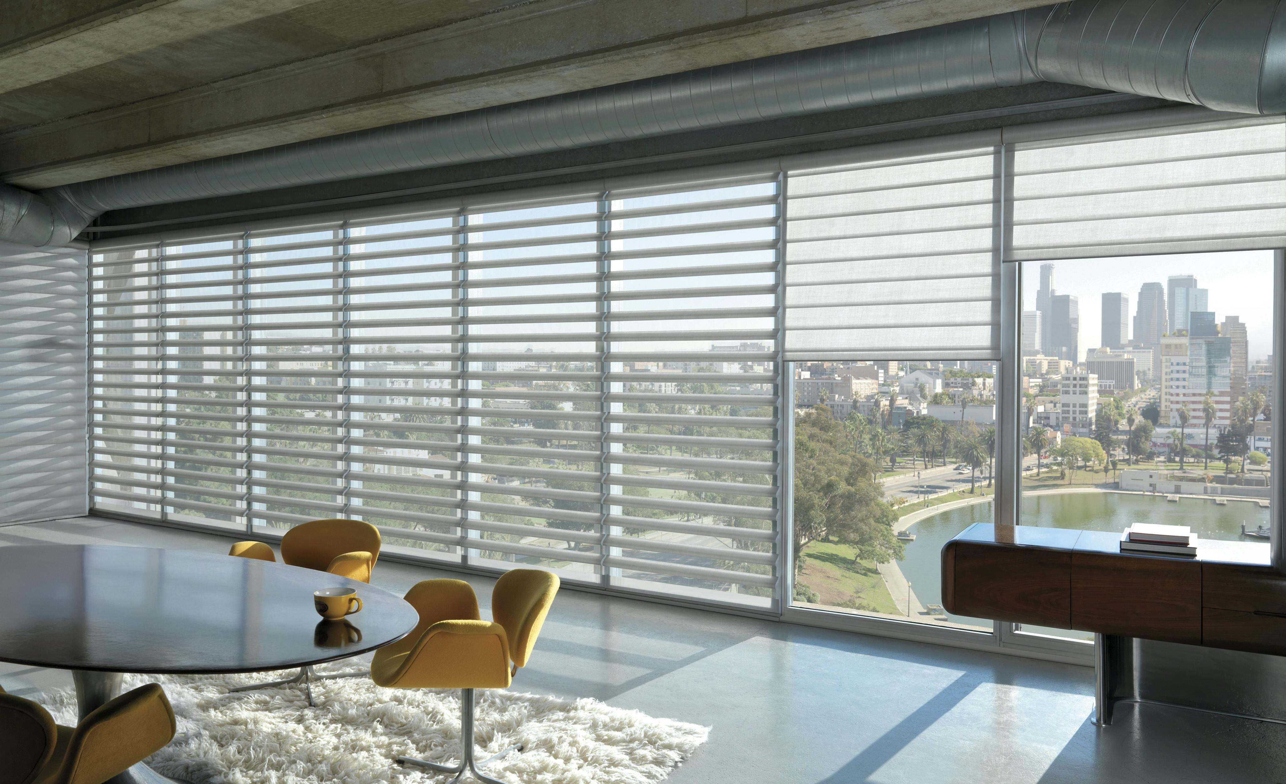 White pirouette shades on windows in an office at a high-rise building 