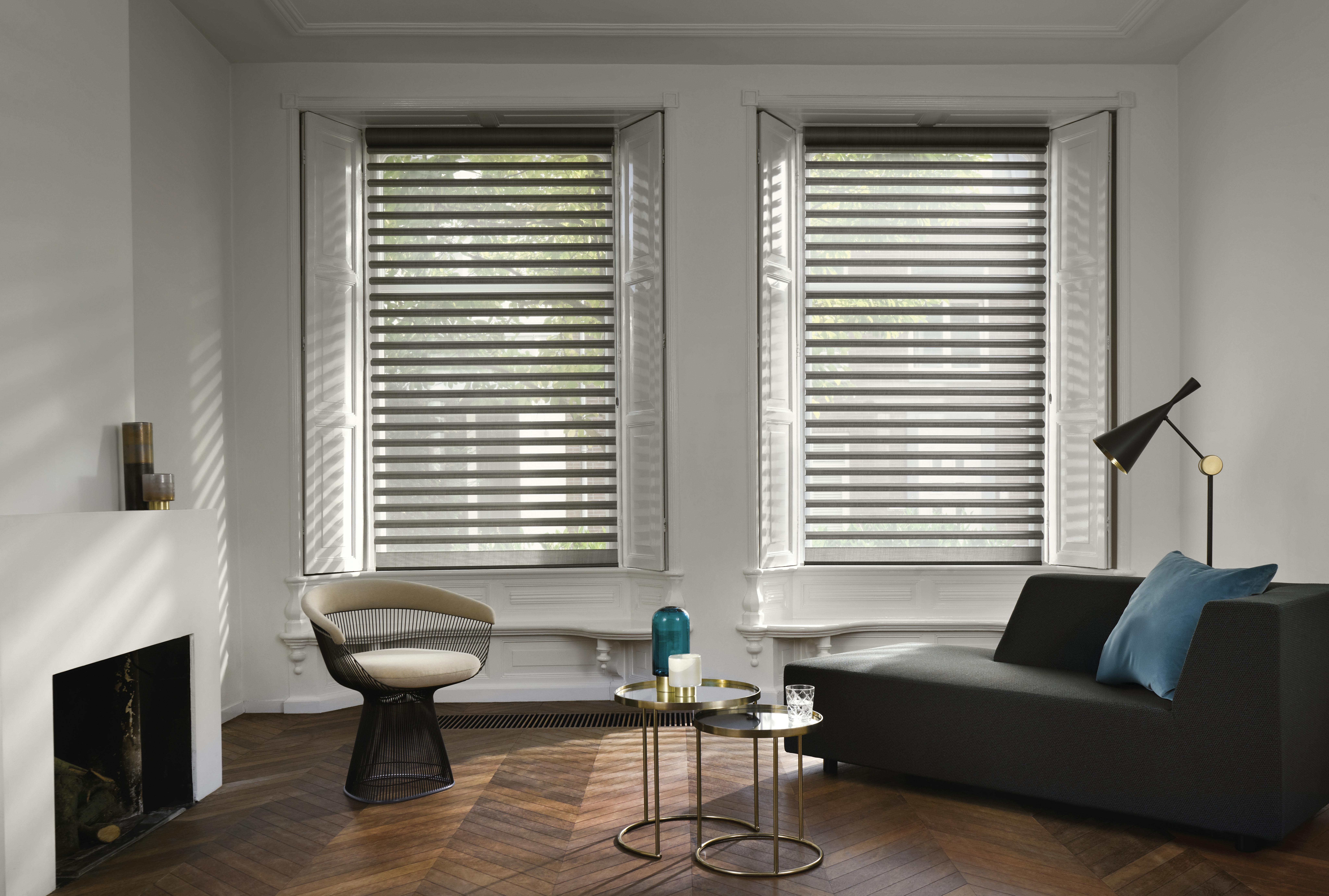 Black Pirouette® blinds on windows in a living room