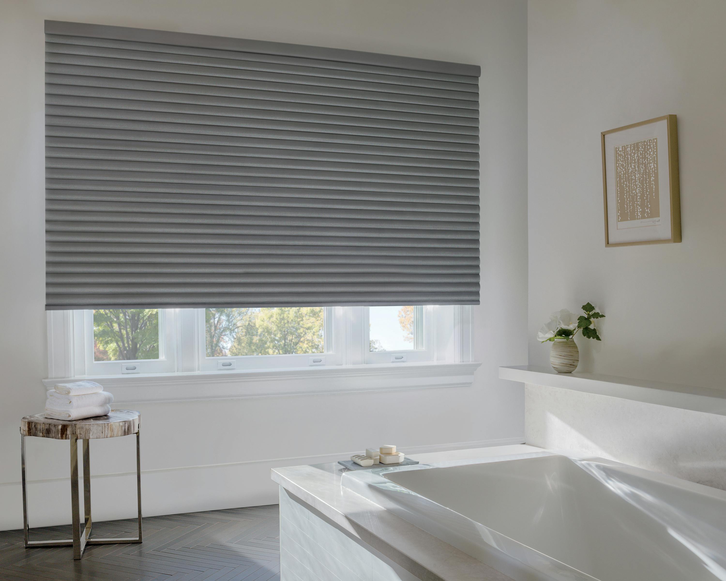 Grey sonnette shades on a bathroom window