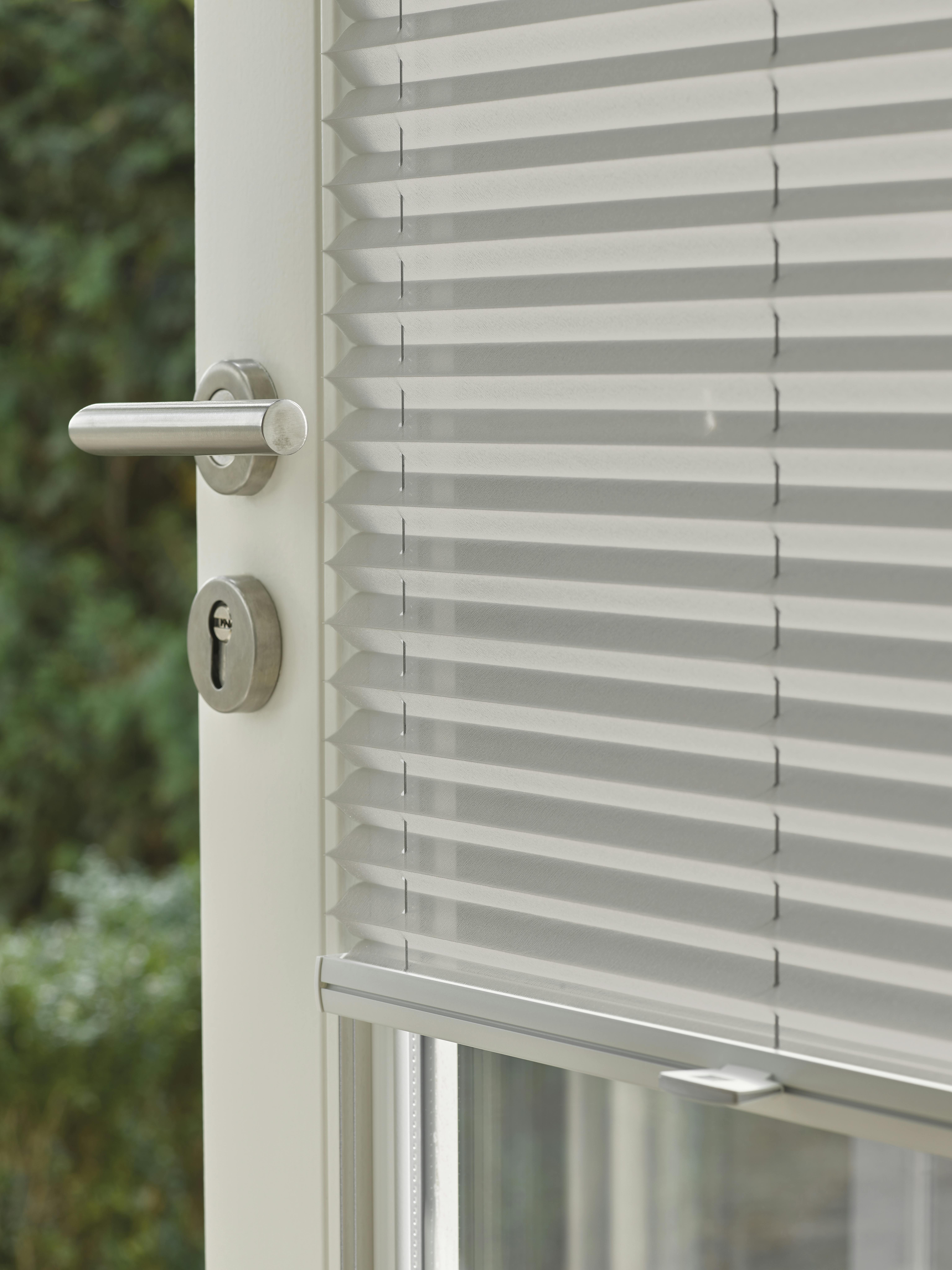 Patio door with grey plisse shades fitted with Trufit