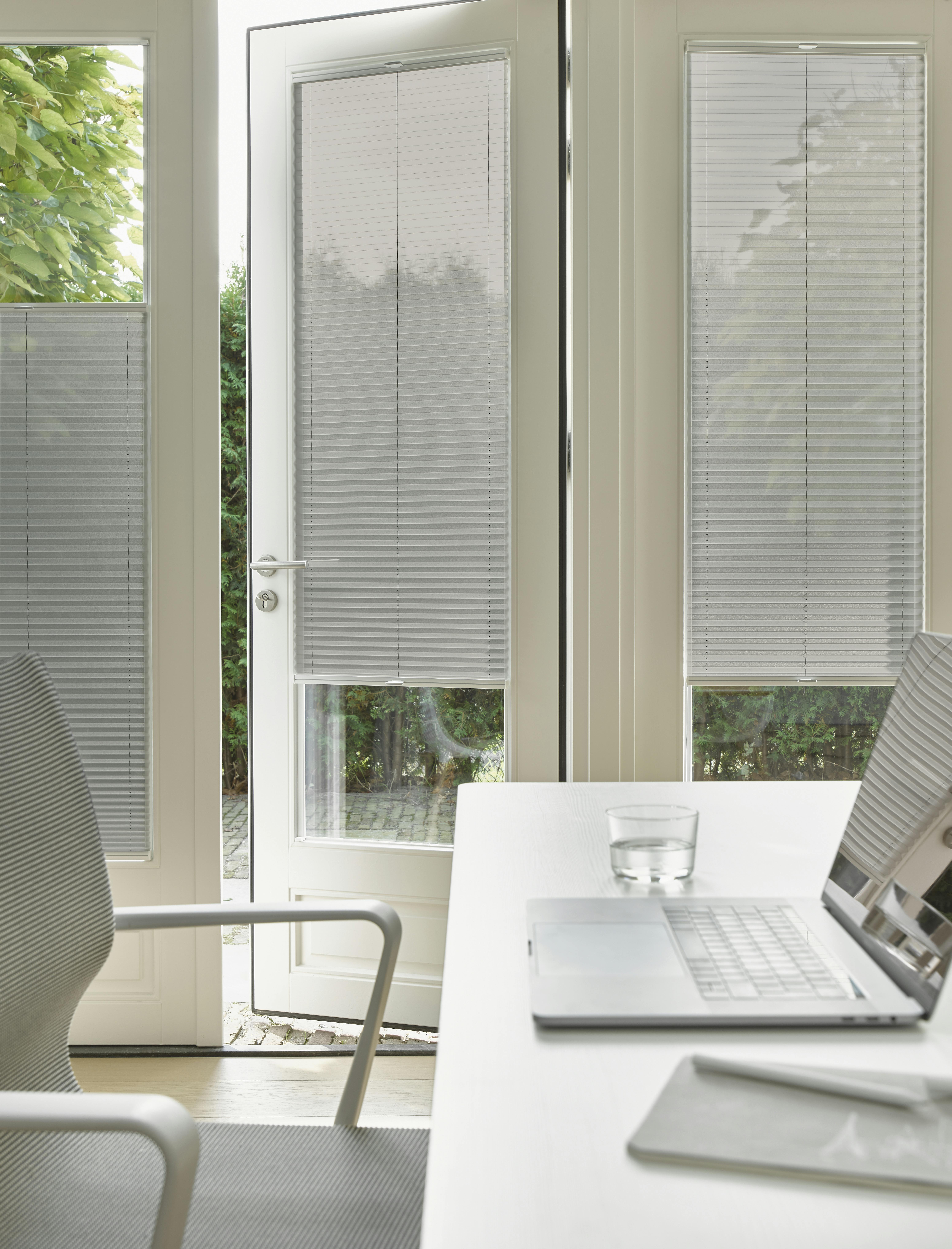 Grey plisse shades on patio doors with TruFit solution