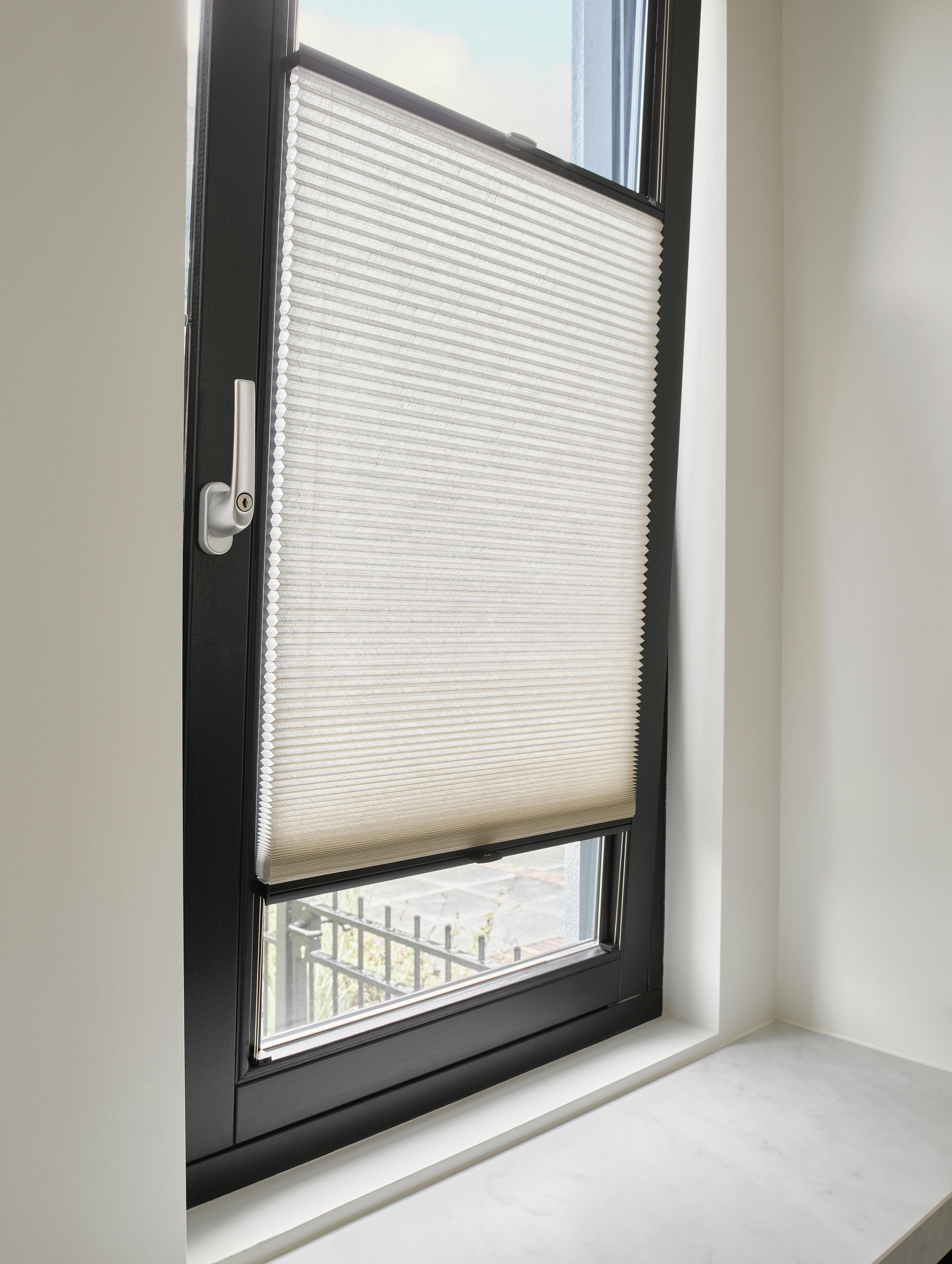 Beige duette shades on a tilt & turn window with TruFit solution
