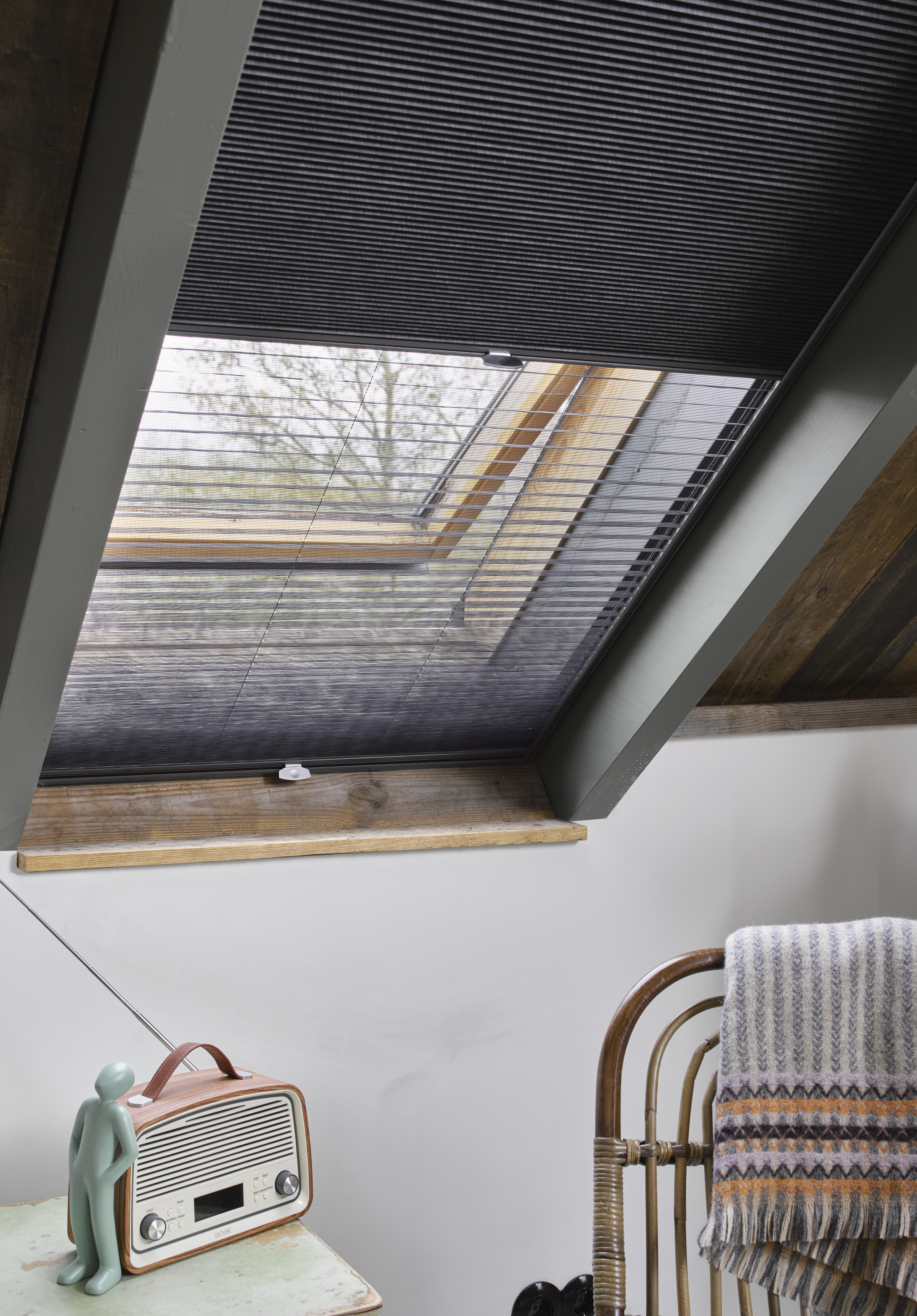 Dark grey duette shades on skylight windows 