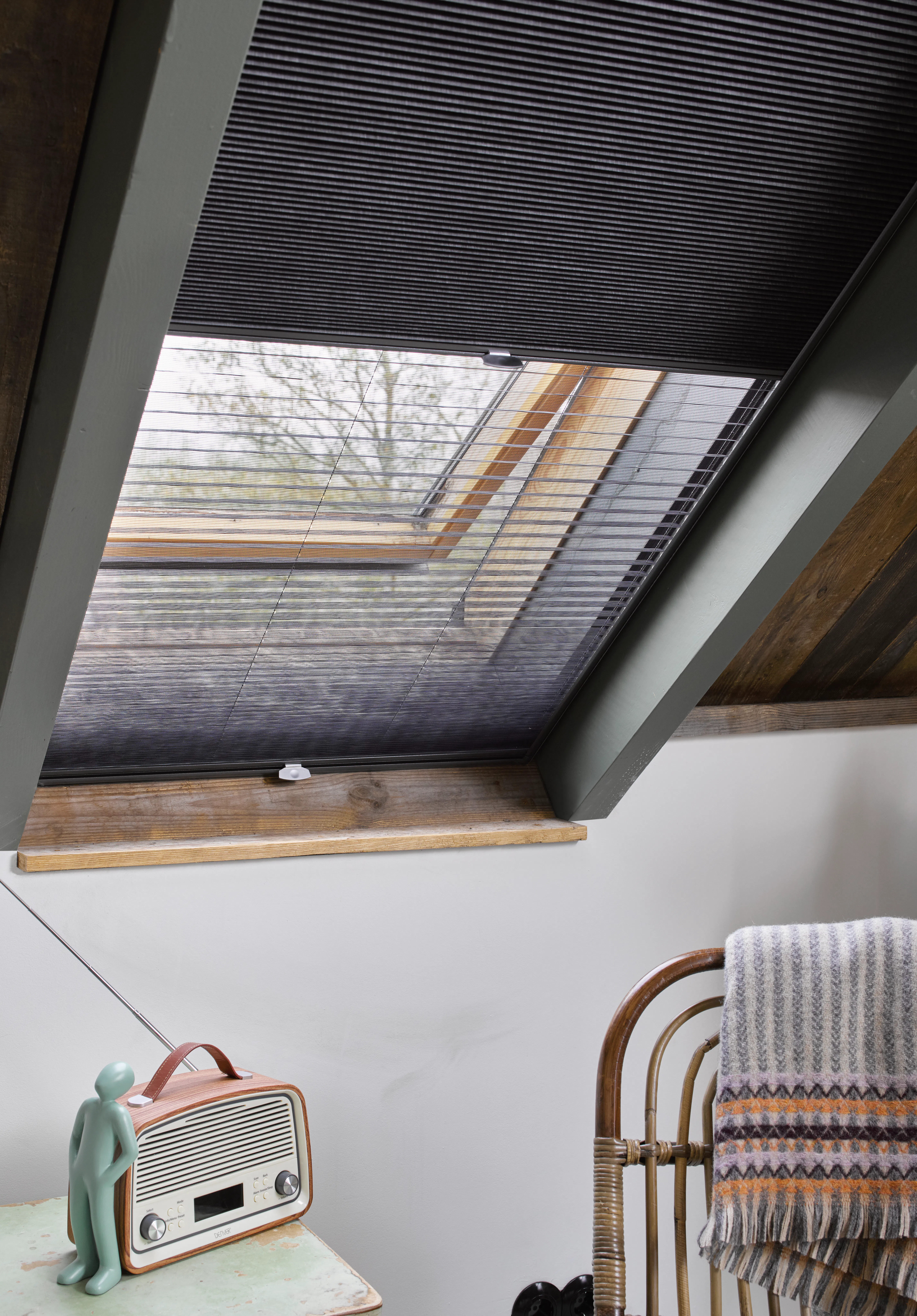 Dark grey duette shades on skylight windows 