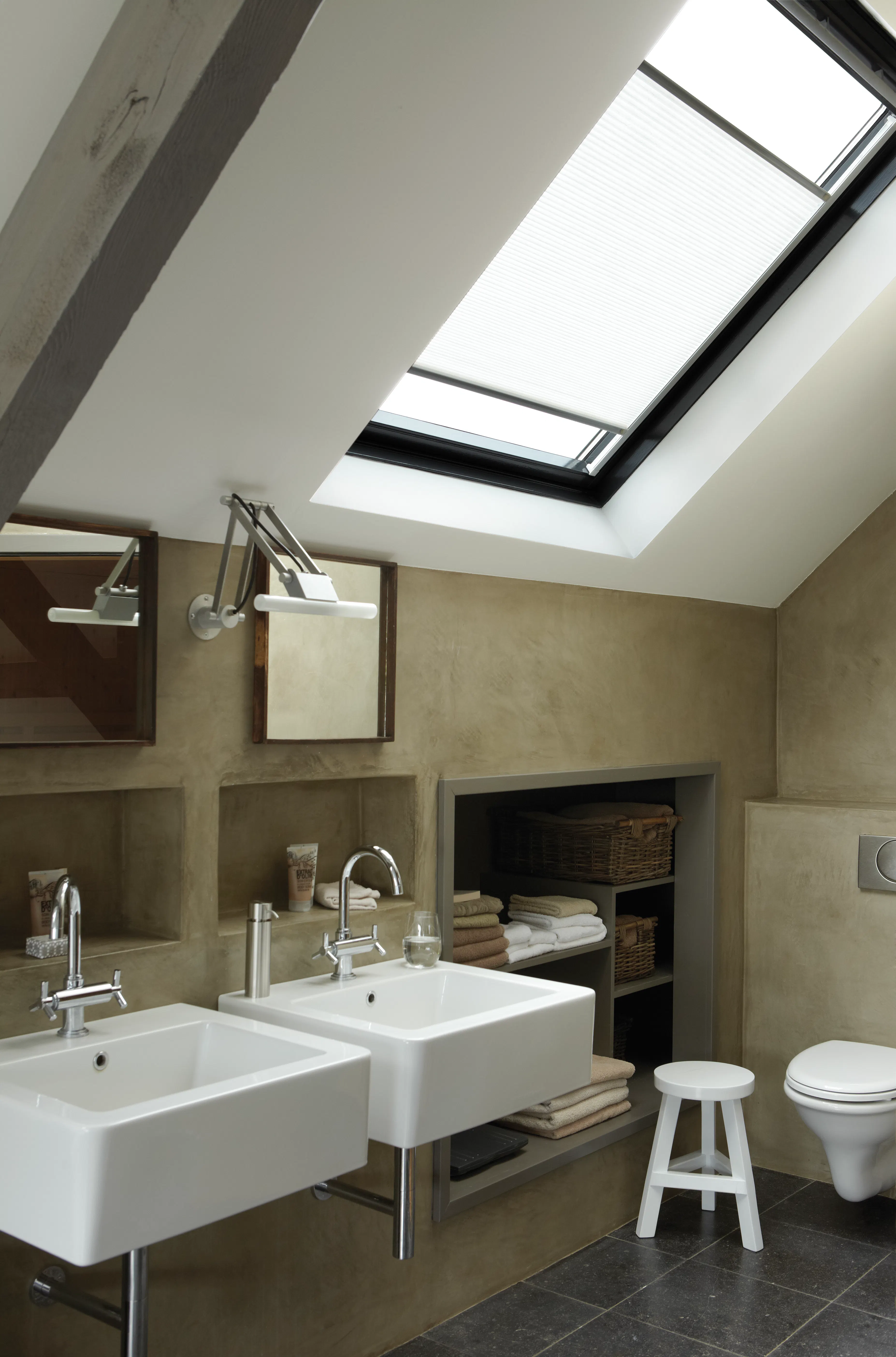 White duette shades on a skylight window in a bathroom 