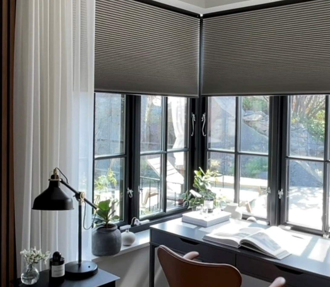 Grey duette shades in a home office