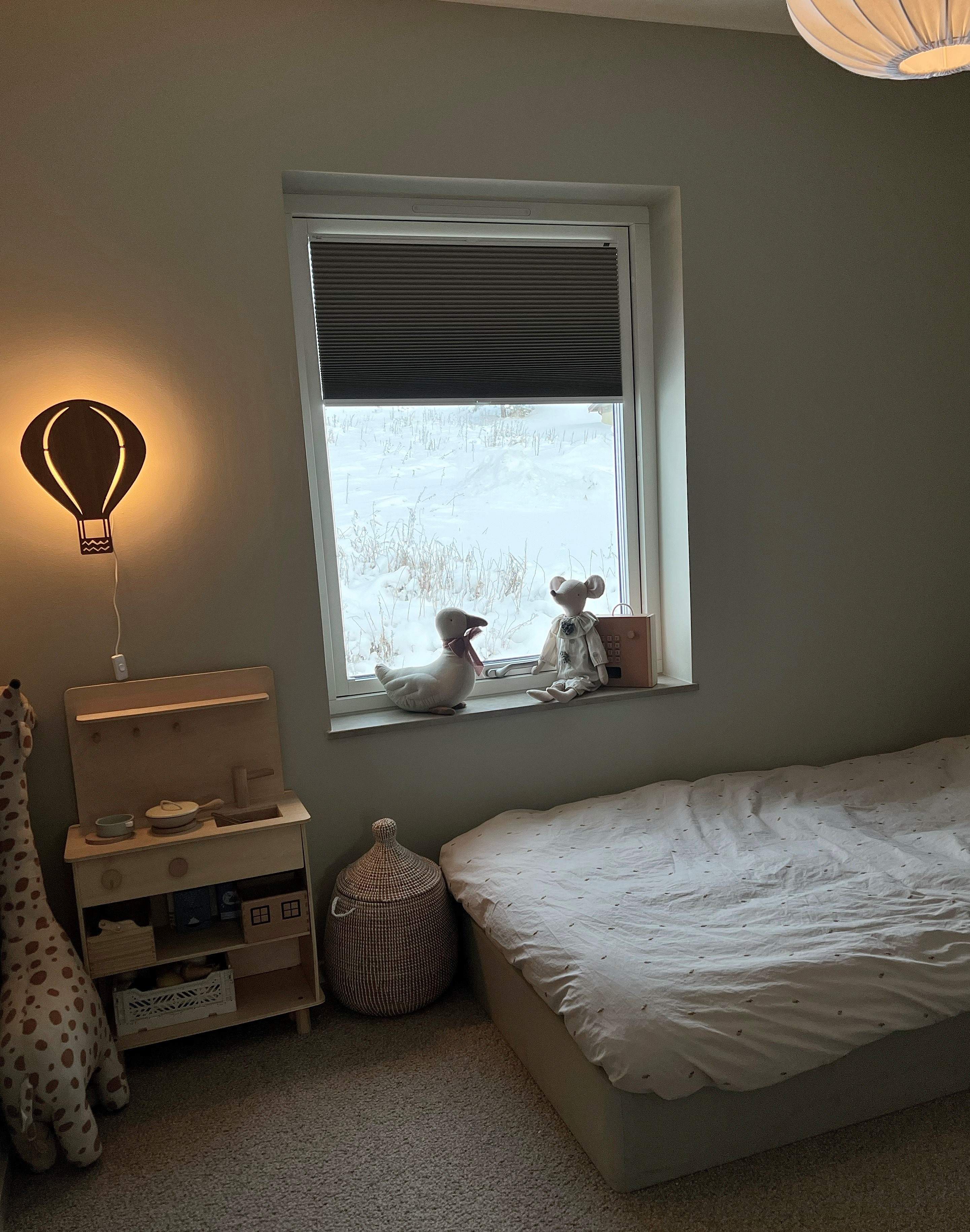 Grey duette shades in a kids room