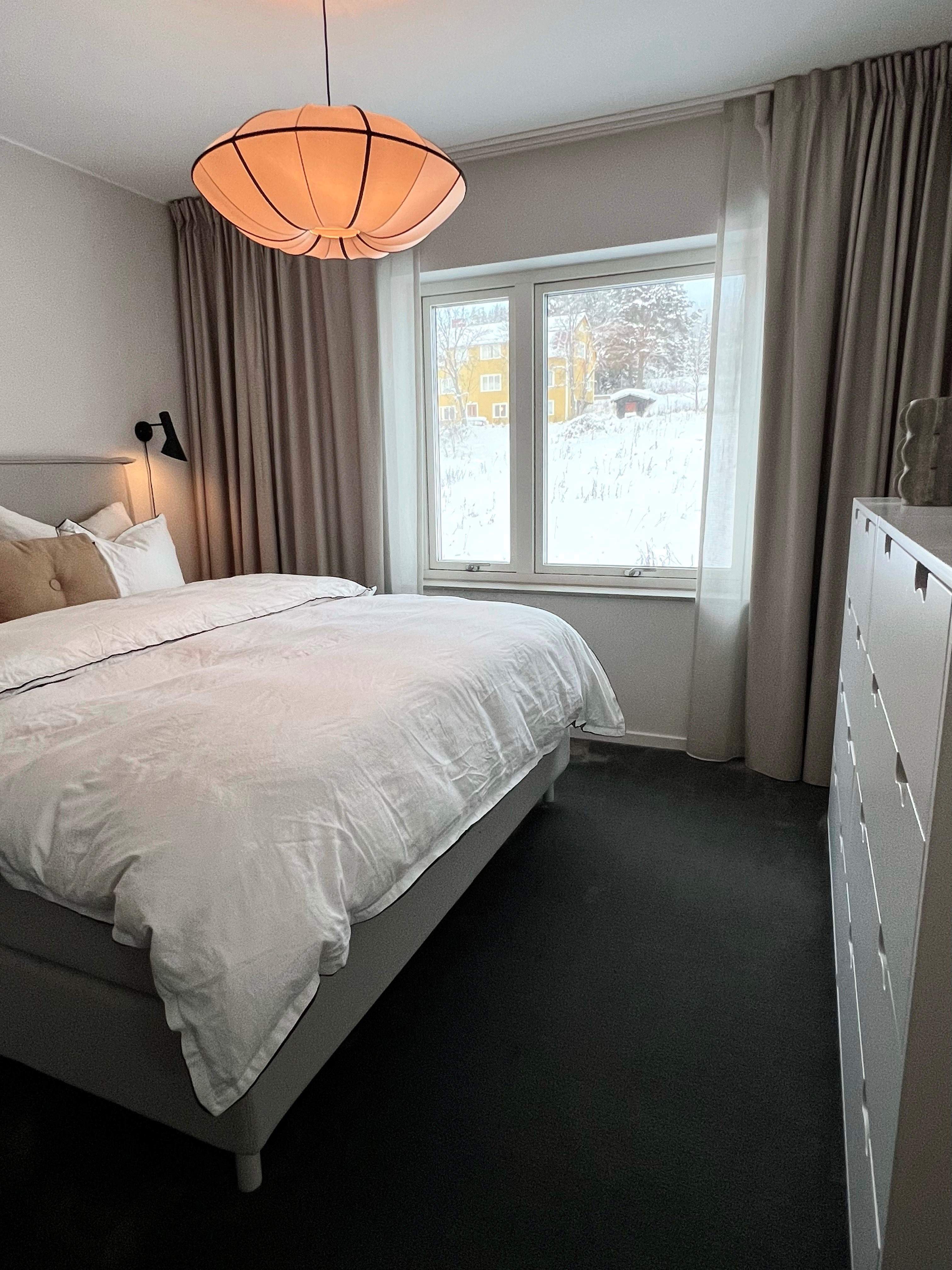Beige curtains in a bedroom 