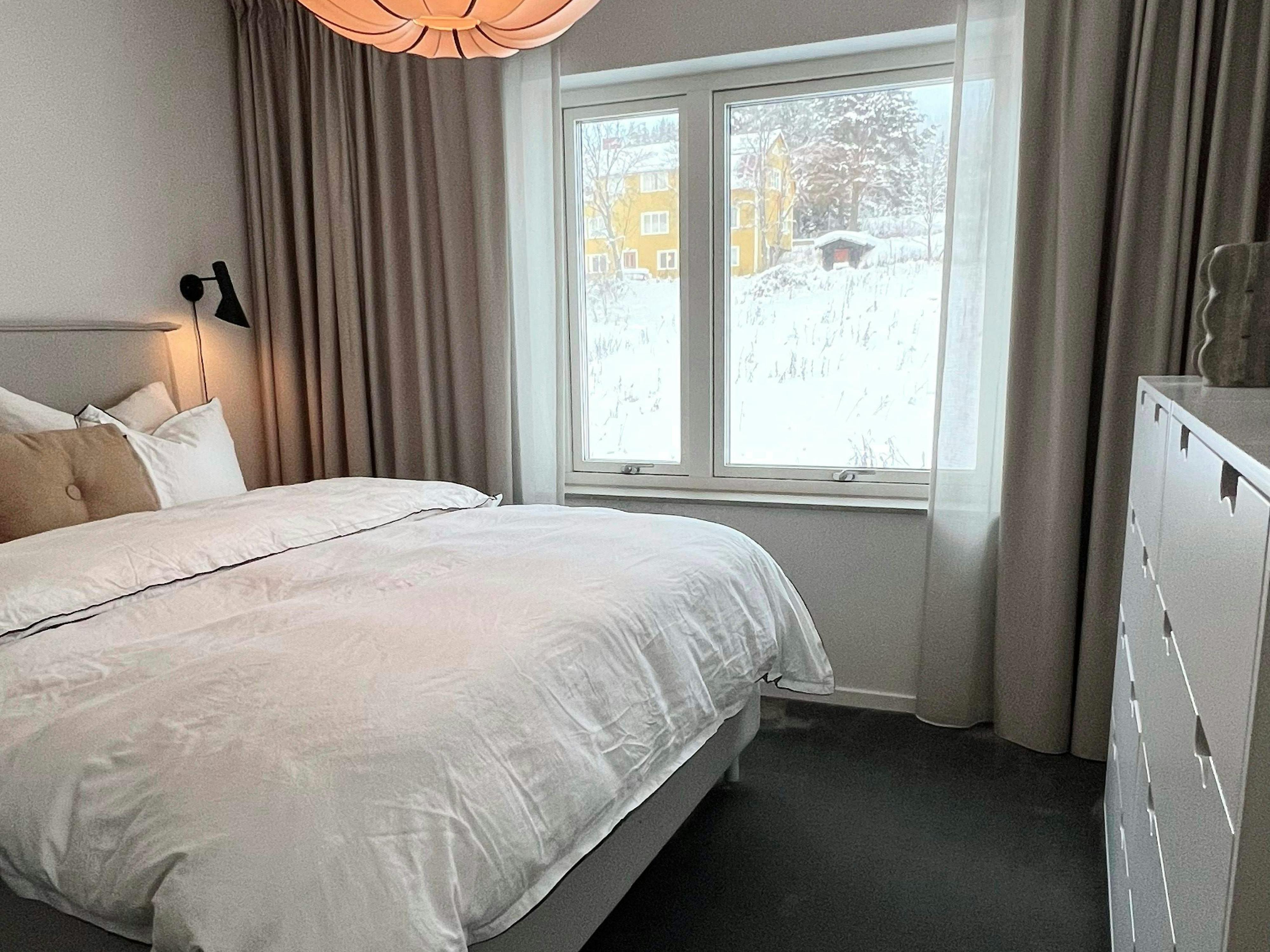 Beige curtains in a bedroom