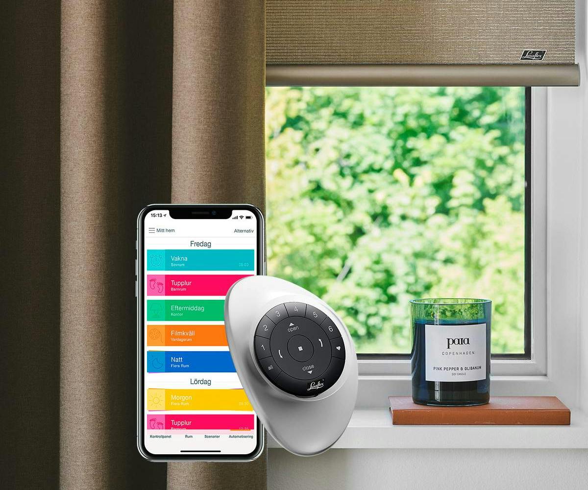 Brown curtains with beige roller blinds overlayed with Powerview automation and pebble remote