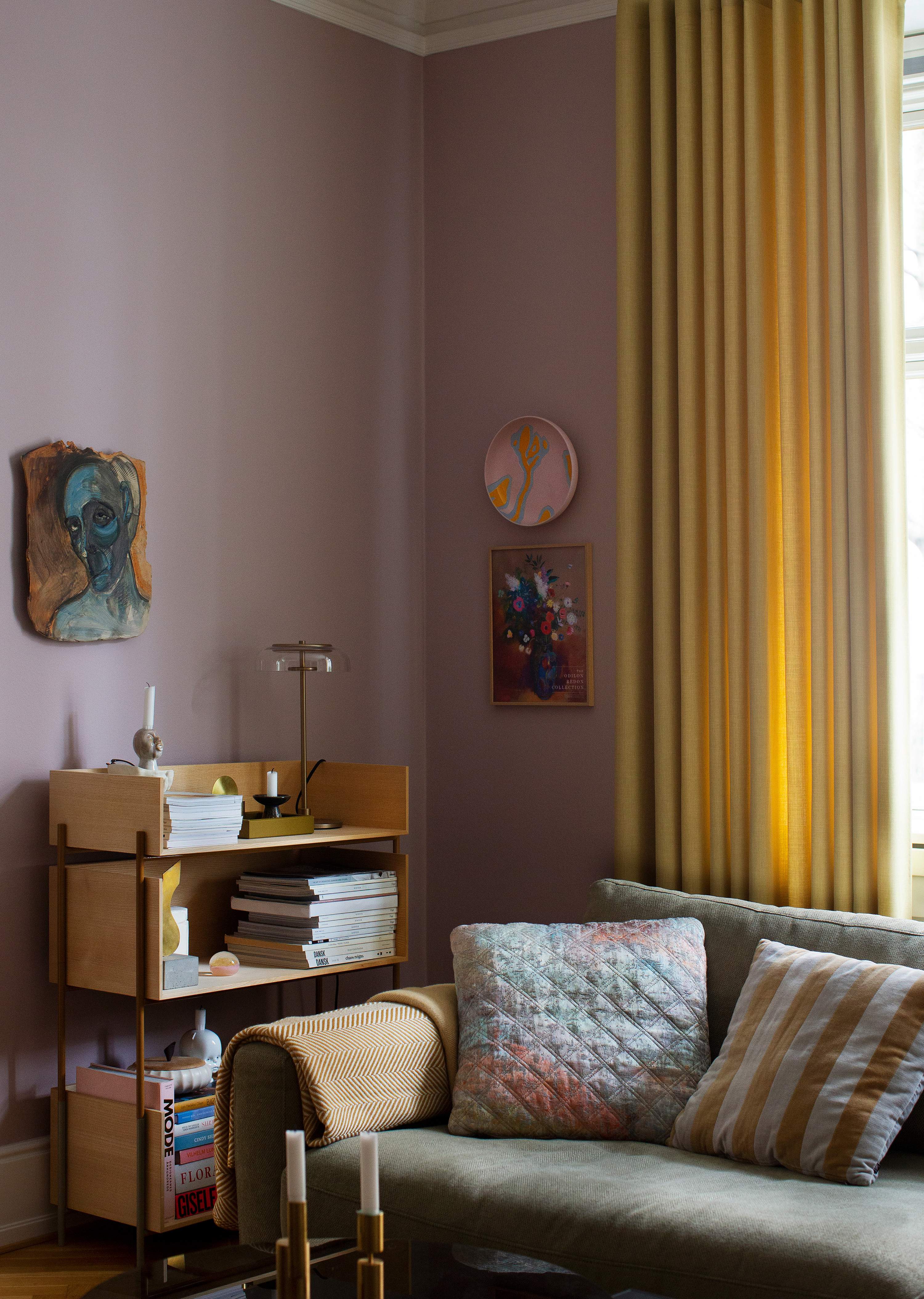 Yellow curtain in a purple living room 