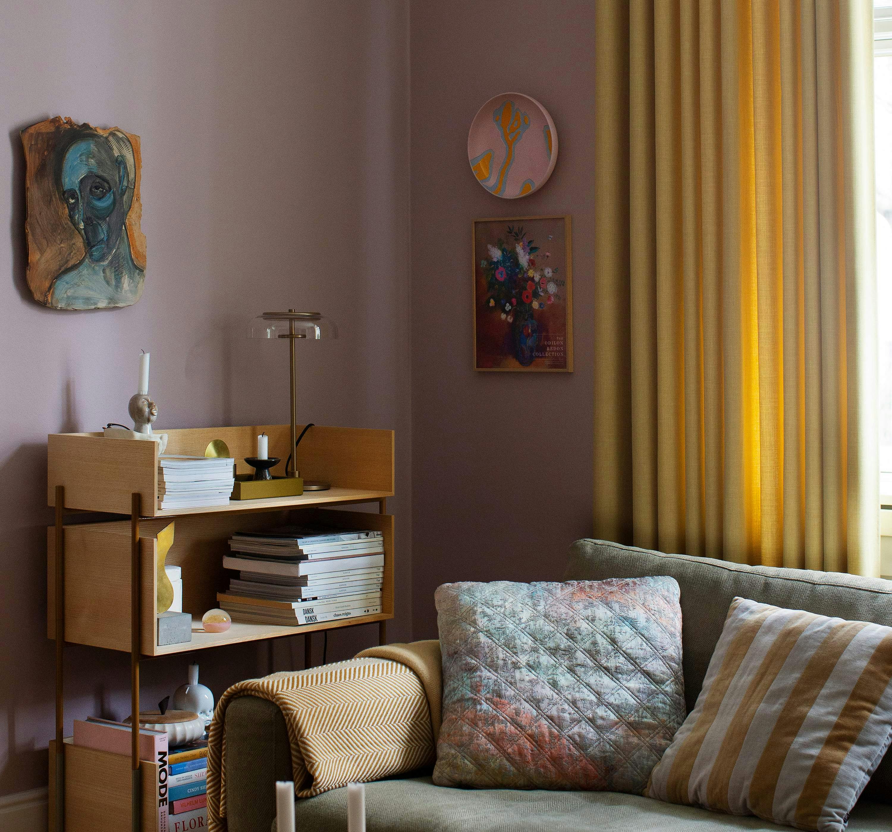 Yellow curtain in a purple living room